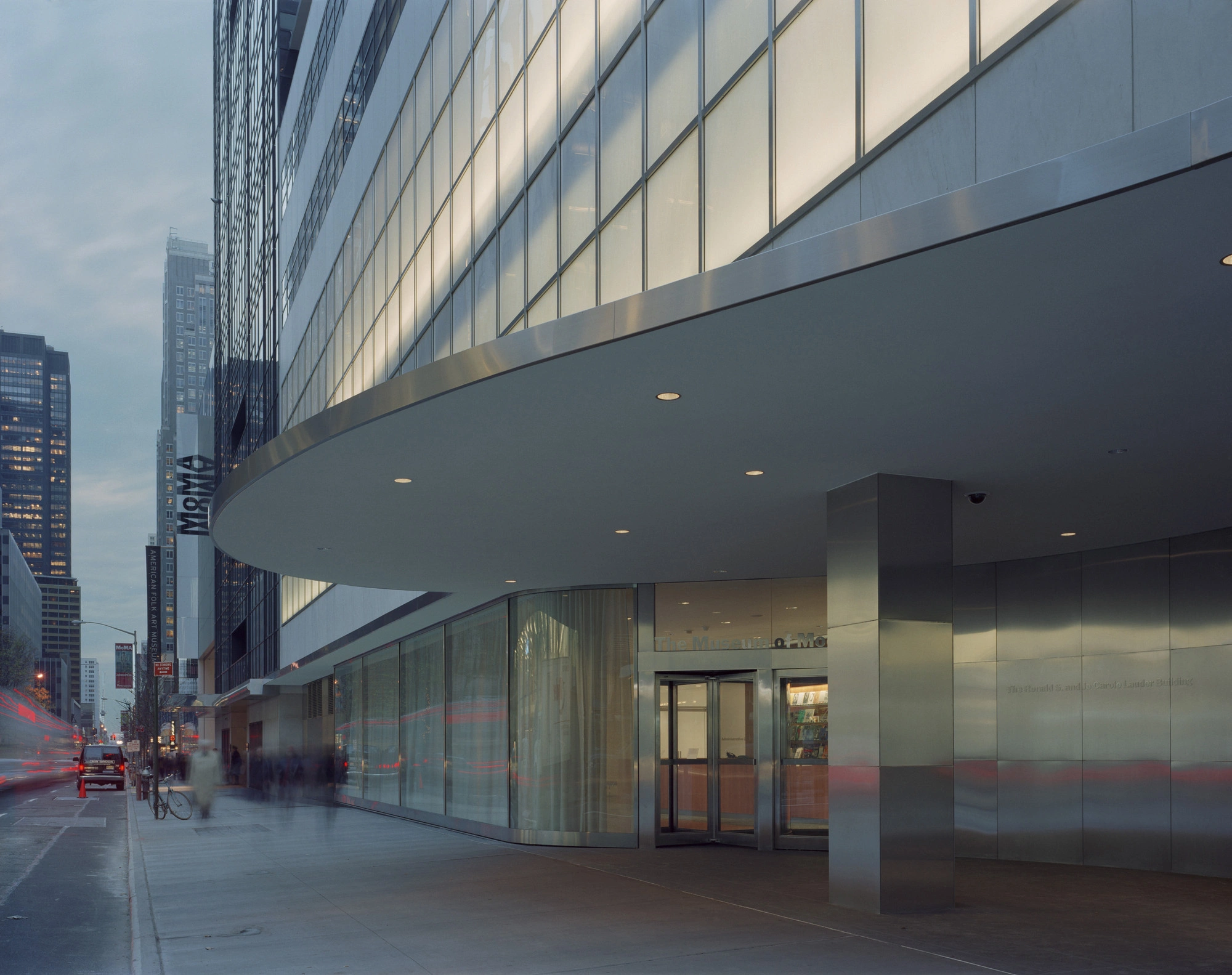 Museum of Modern Art in New York by Yoshio Taniguchi — Street-level view of MoMA's expansion showing the seamless integration of Taniguchi's addition with the urban context.