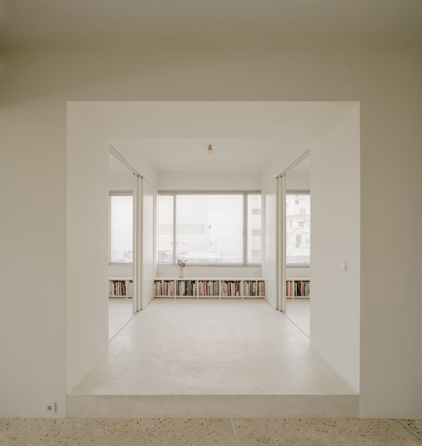 'Astral Weeks' by Oblique — A recessed residential alcove carved from a 1970s office building, framed by the threshold of the preceding room.