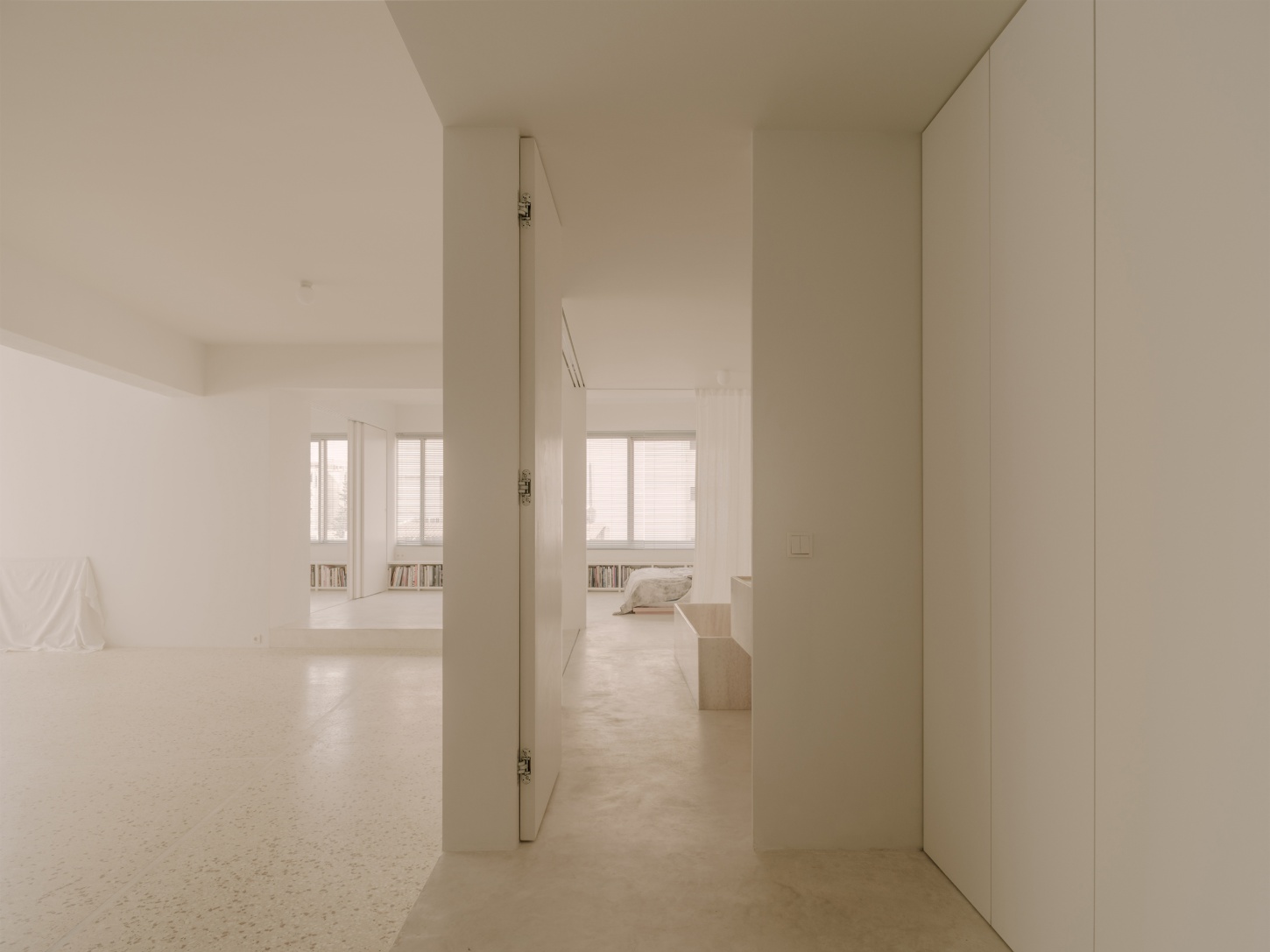 'Astral Weeks' by Oblique — A corridor perspective within the adaptive conversion reveals the spatial strategy necessitated by the building's structural constraints.