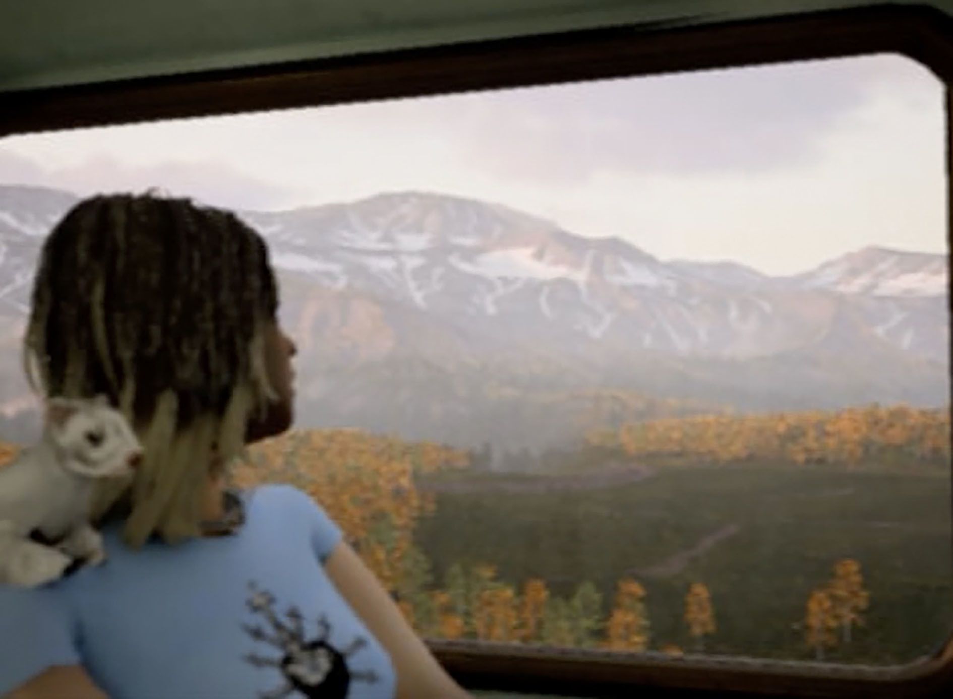 Proof of Concept by Jon Rafman at Sprüth Magers LA — A figure in a light blue t-shirt with white graphic print sits before a large LED screen displaying a misty mountain valley landscape with coniferous forest.