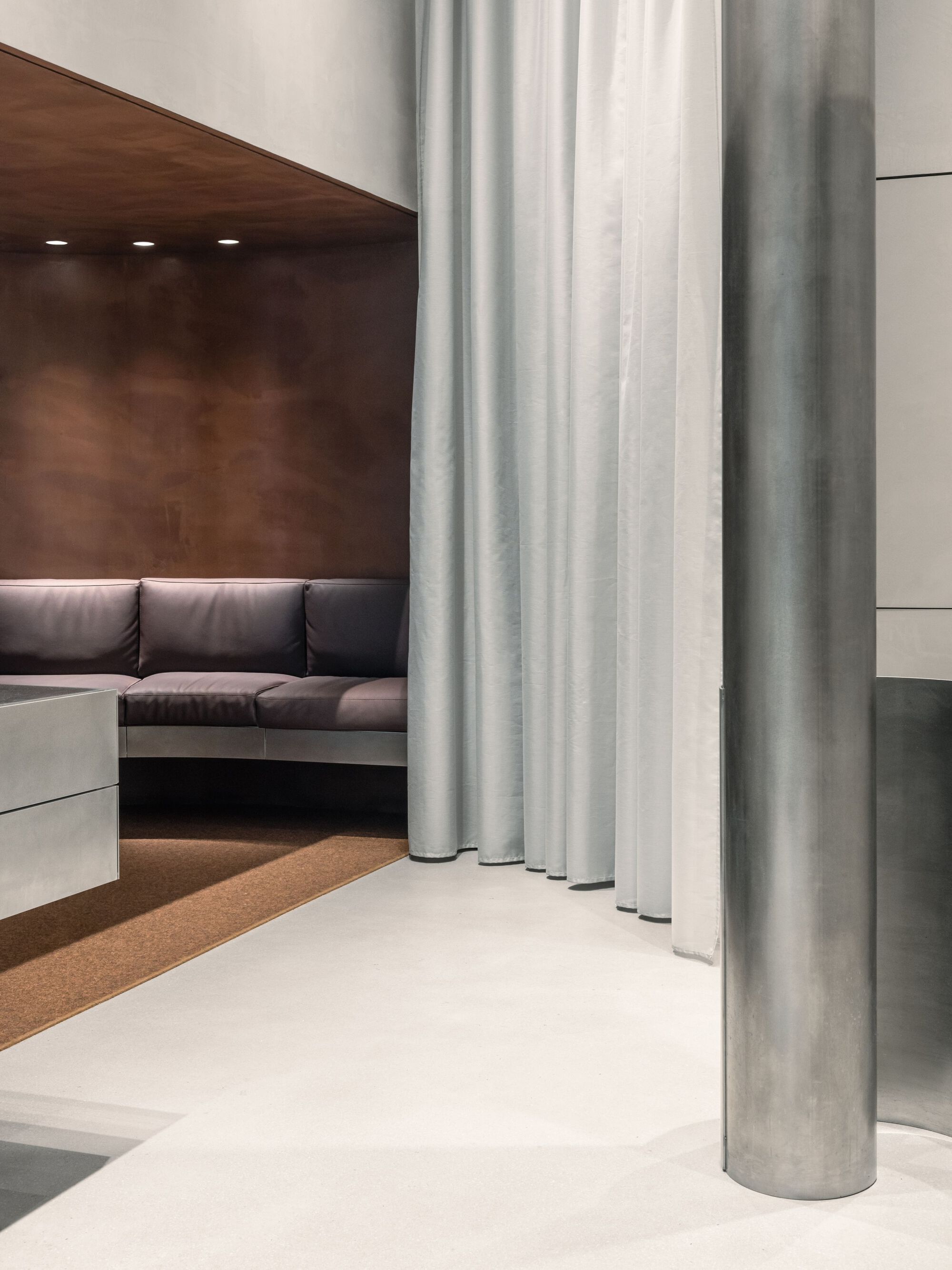 Aesop Store Barcelona by BAROZZI VEIGA — A passage within the Aesop Store Barcelona reveals the interior spatial strategy through layered materiality and controlled thresholds.