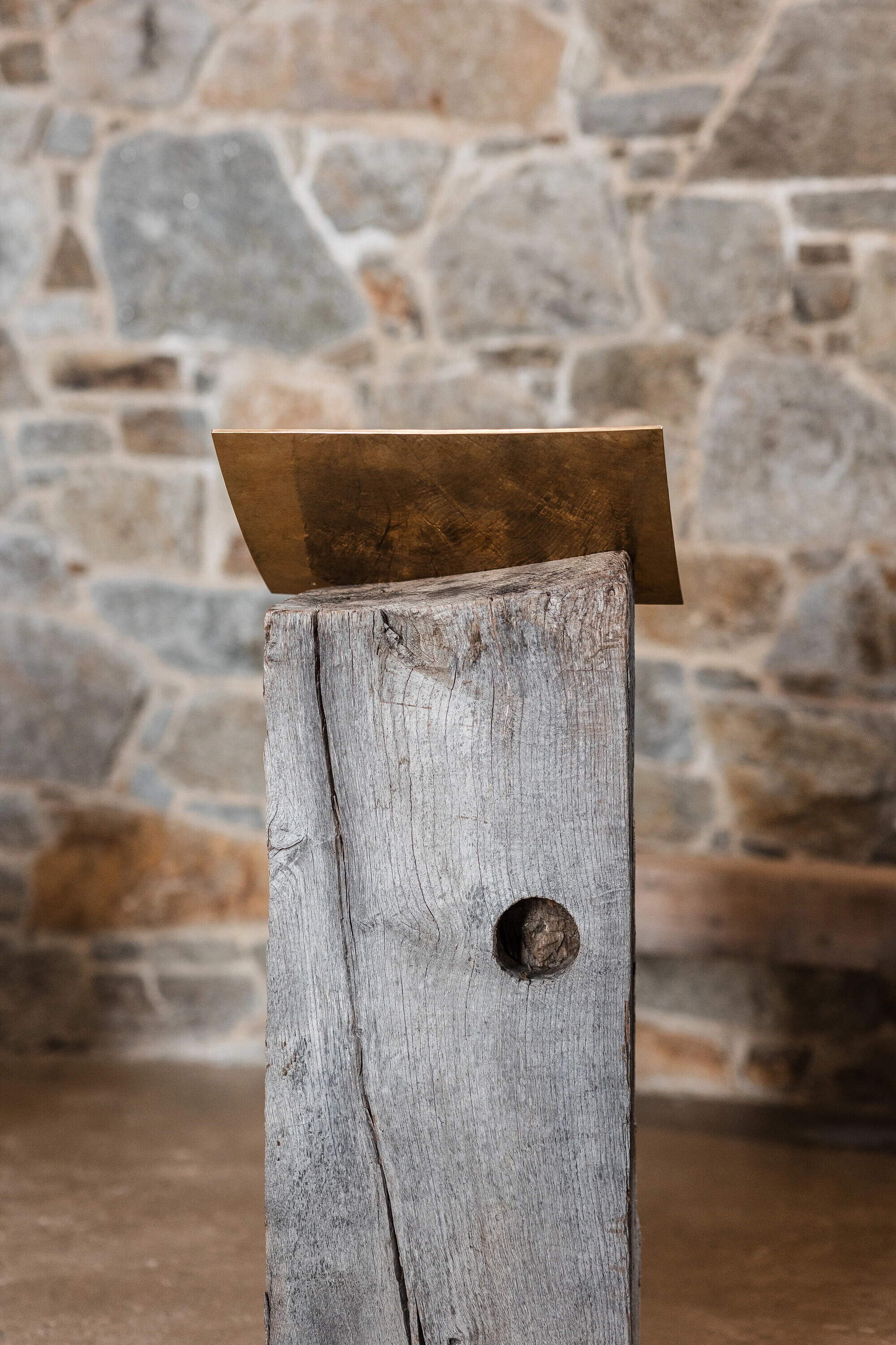 Our Lady of Sorrows Chapel by RCNKSK — A weathered timber post anchors the chapel's threshold, its silvered wood grain marking decades of exposure.