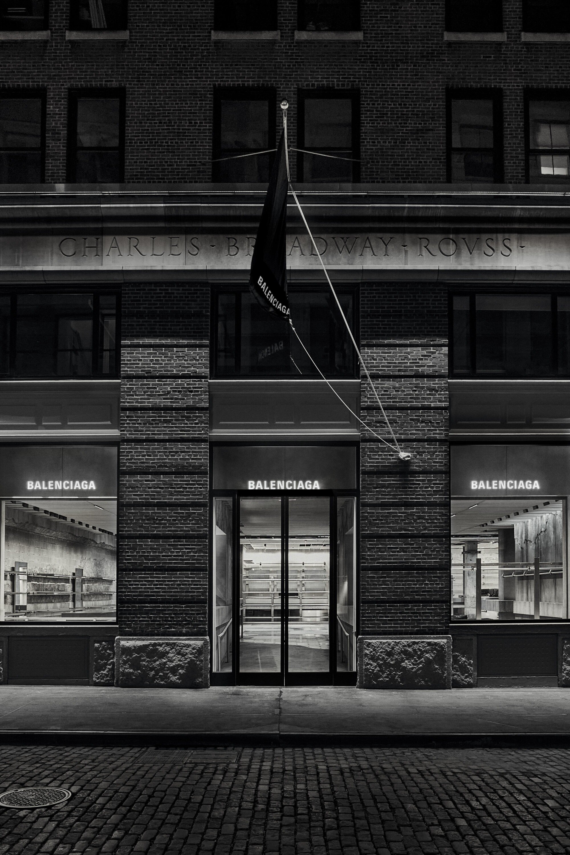 Balenciaga Greene Street Flagship Store in New York — Street-level view of the Balenciaga Greene Street flagship storefront, a black-and-white photograph documenting the facade's material honesty.