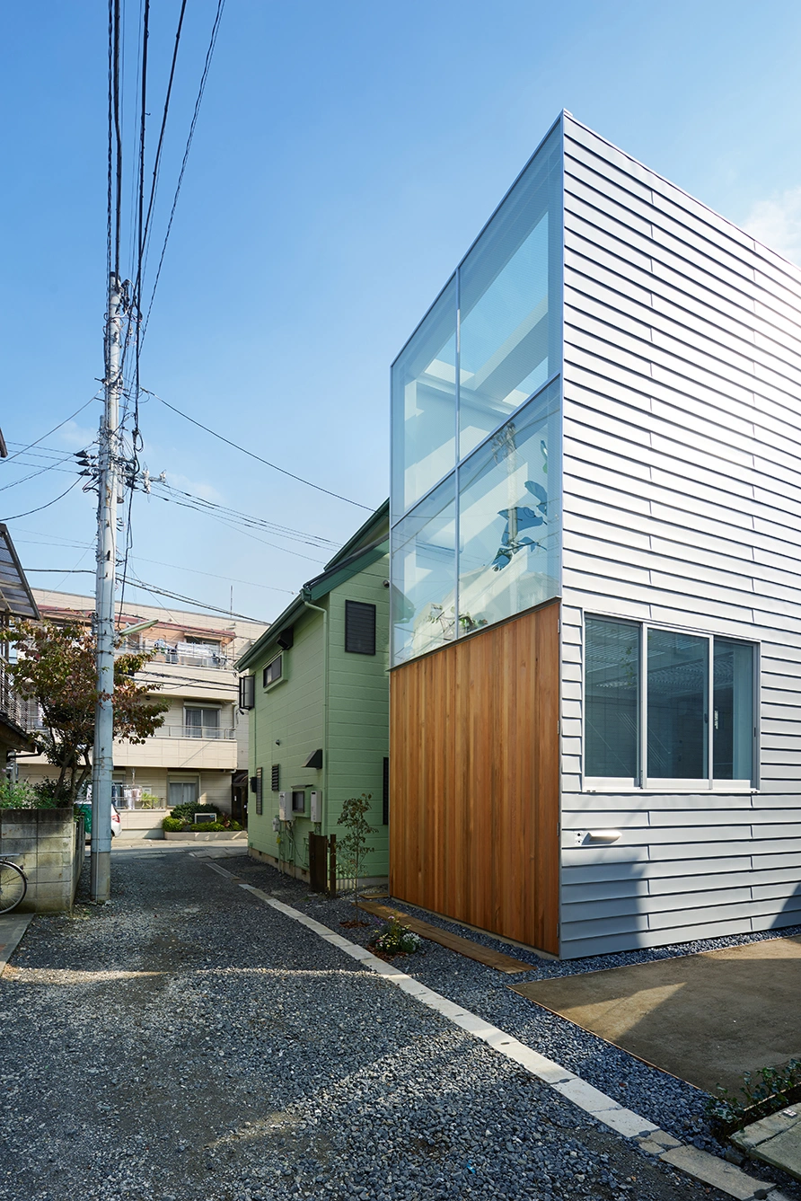 House in Kawasaki by Taichi Mitsuya & Associates — The House in Kawasaki reveals its material hierarchy through compressed street frontage.