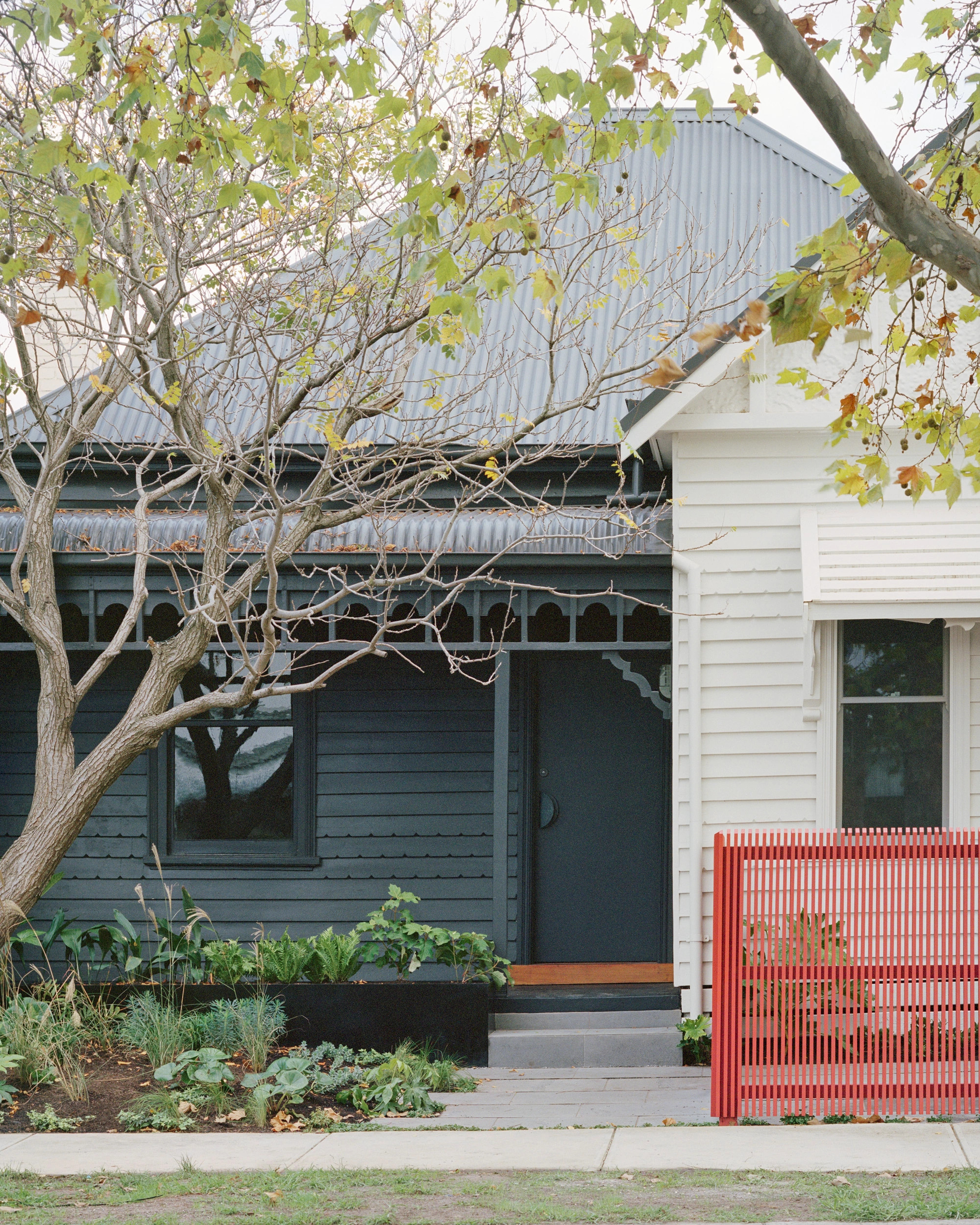 House K by Kart Projects — The street facade of House K demonstrates material and formal contrast through layered interventions.