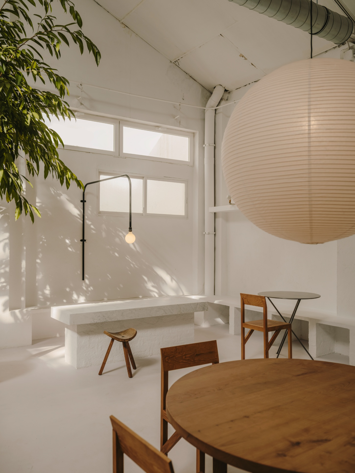 Alma Nomad by Plantea Studio by Plantea Estudio — A dining space defined by material restraint and spatial clarity.