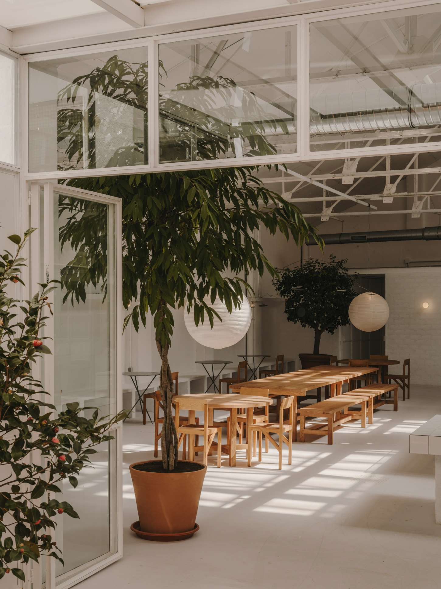 Alma Nomad by Plantea Studio by Plantea Estudio — A dining pavilion defined by industrial clarity and botanical integration.