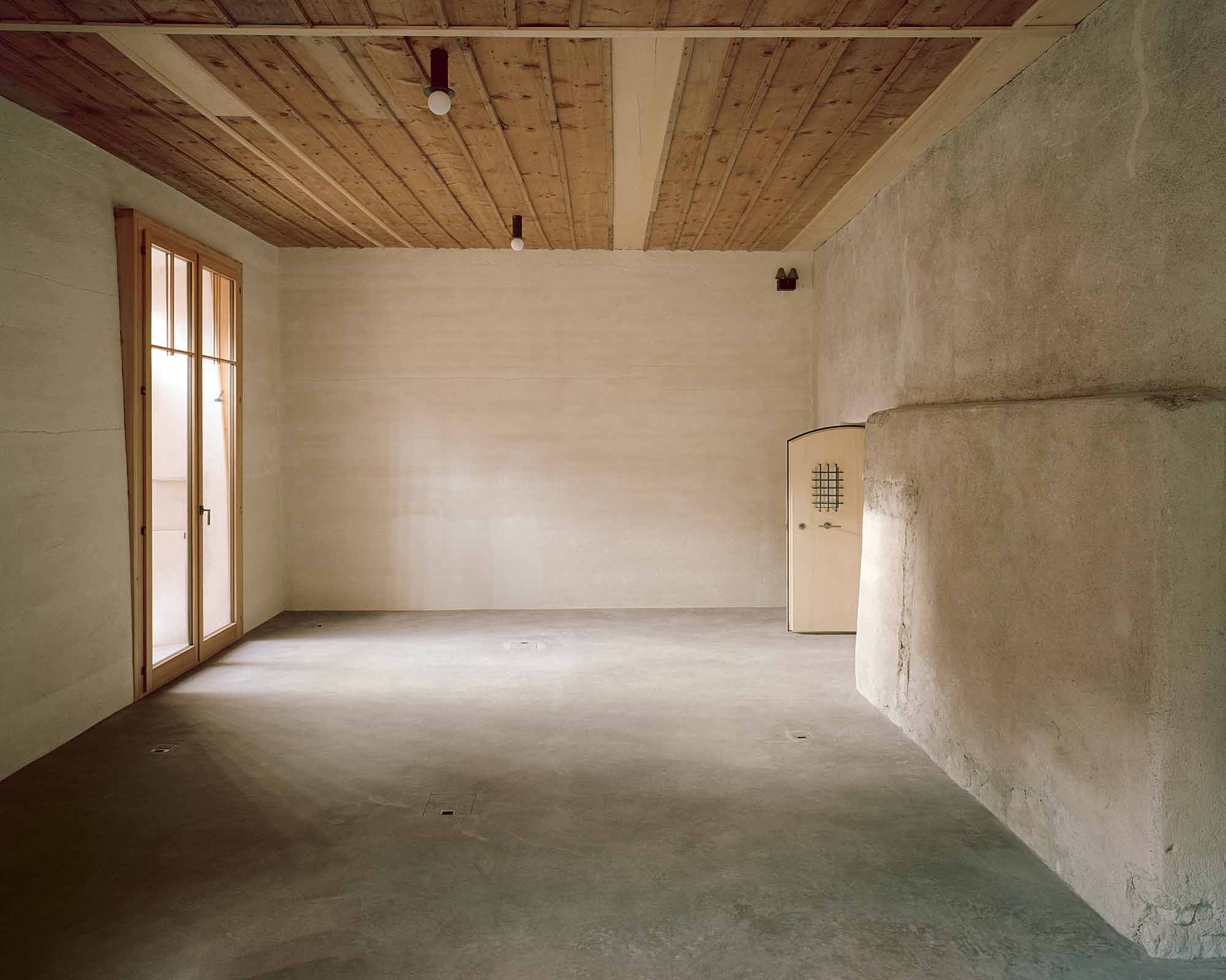Mühle Ennenda by Atelier Lando Rossmaier — A gutted interior space reveals the archaeological layering of Mühle Ennenda's transformation.