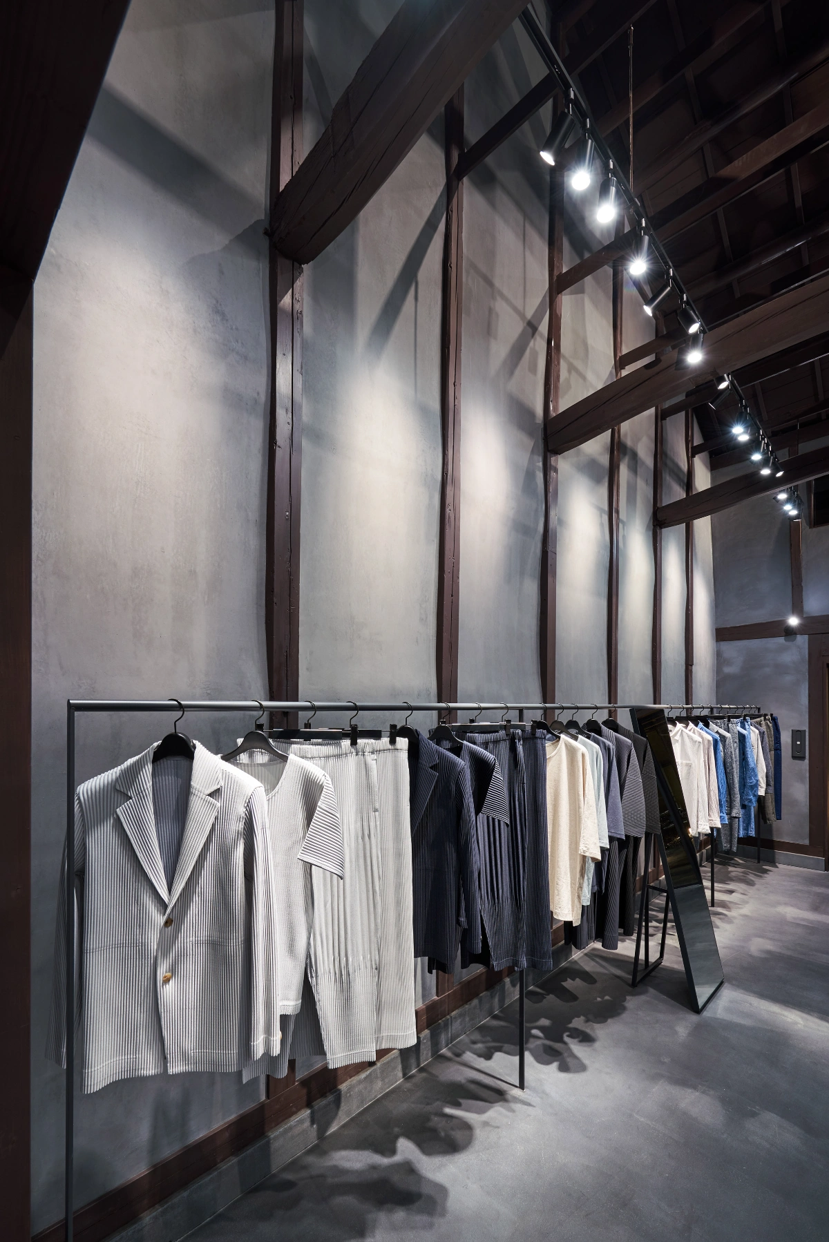 Issey Miyake Kyoto by Naoto Fukasawa Design — Interior display of the Issey Miyake Kyoto store reveals a minimalist presentation strategy against monochromatic walls.