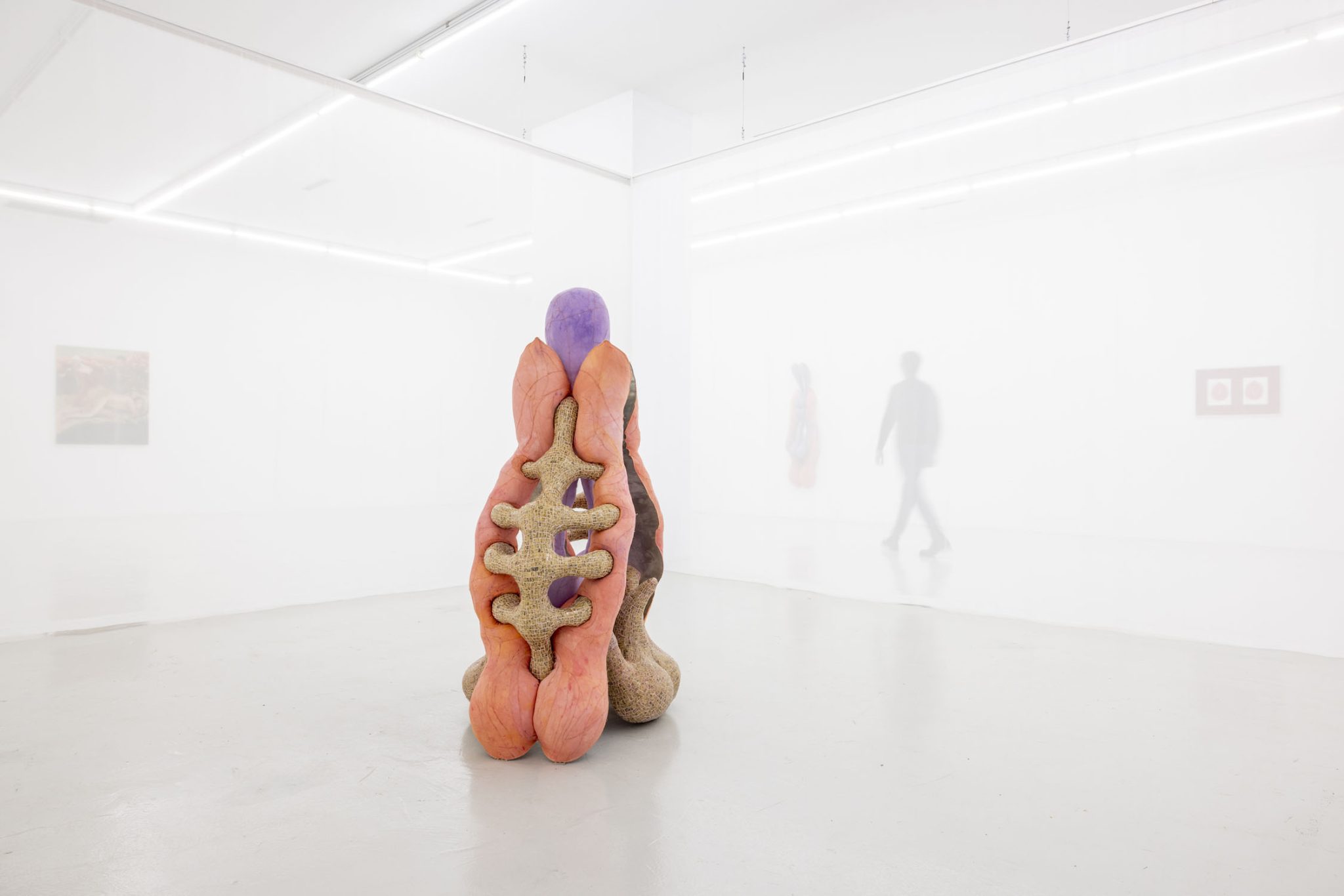 Viscous Group Show at Cassina Projects — A sculptural form dominates the white gallery floor, constructed from terracotta in warm salmon and rust tones.