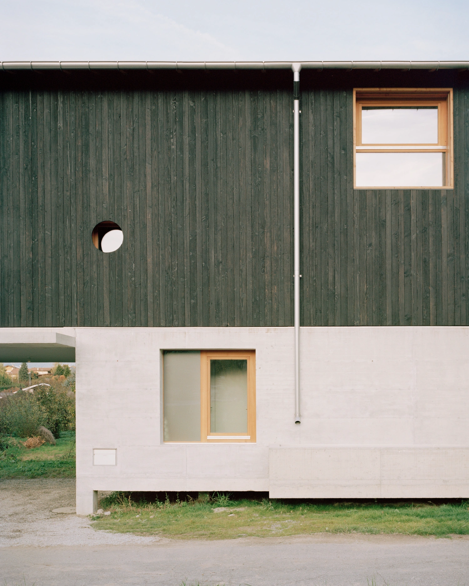 The Wandering House by Lionel Ballmer — The eastern elevation presents a compositional study in material contrast.
