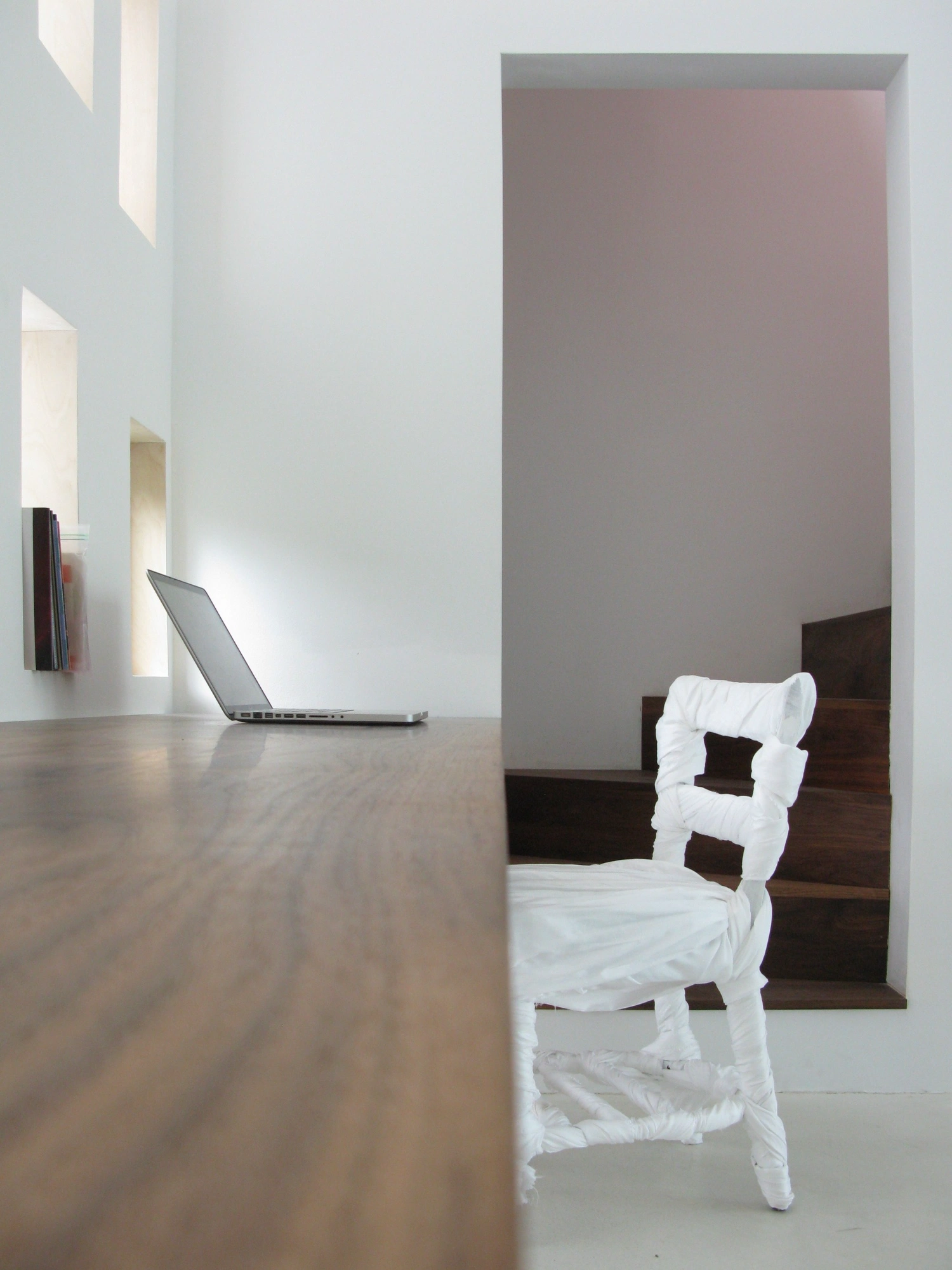 Haffenden House by PARA — Interior view of Haffenden House's writing studio, where natural light from the translucent fabric skin creates soft, diffused illumination across the...