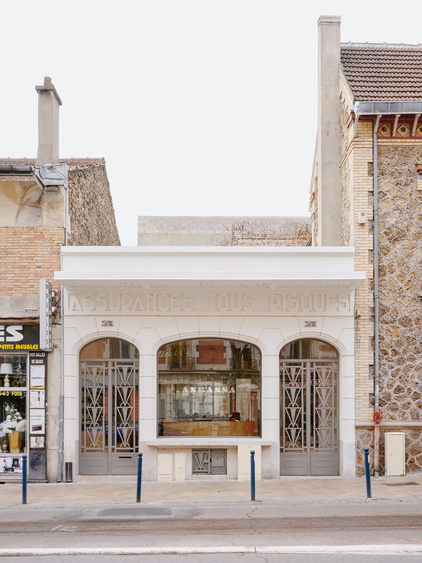 Anbassa by Office Abrami Rojas by Office Abrami Rojas (OAR) — The storefront facade of Anbassa presents a restrained modernist intervention within a historic Parisian streetscape.