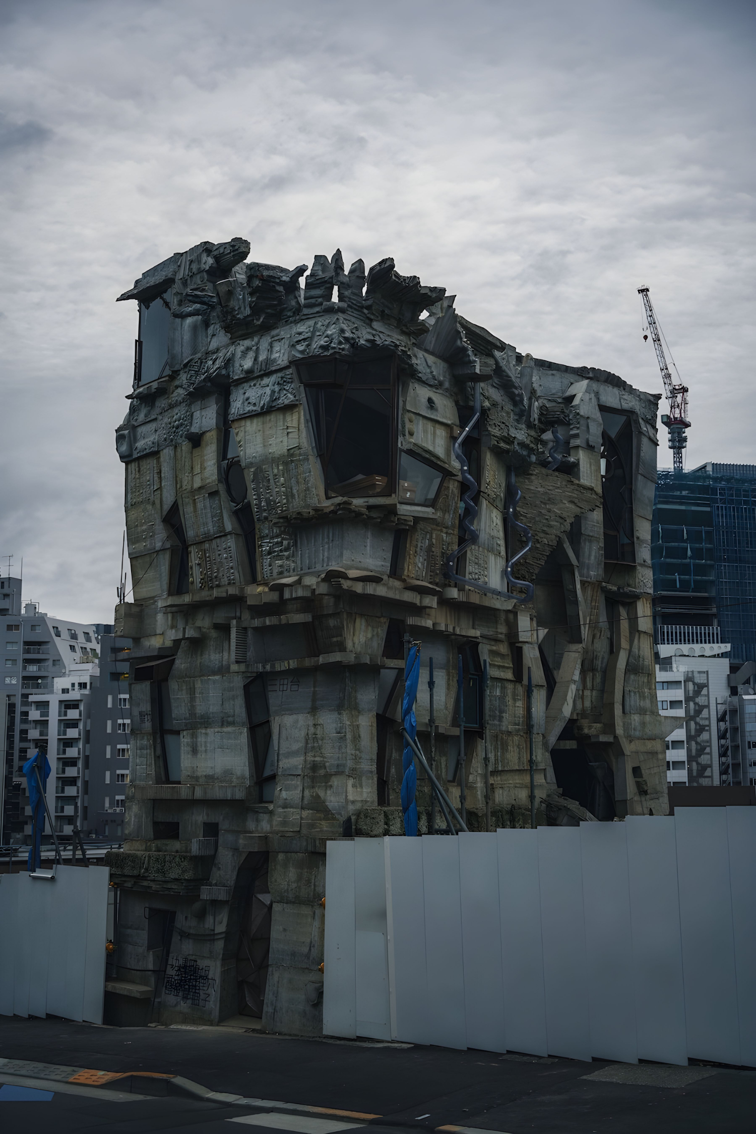 Arimaston Building by Keisuke Oka — The Arimaston Building's weathered concrete tower dominates the frame, its monolithic form fractured by asymmetrical angular windows of varying depths.