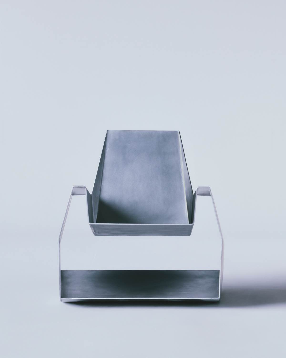 Godspeed by Waiting For Ideas — Front-facing view of Godspeed chair isolates its sculptural profile against neutral backdrop.