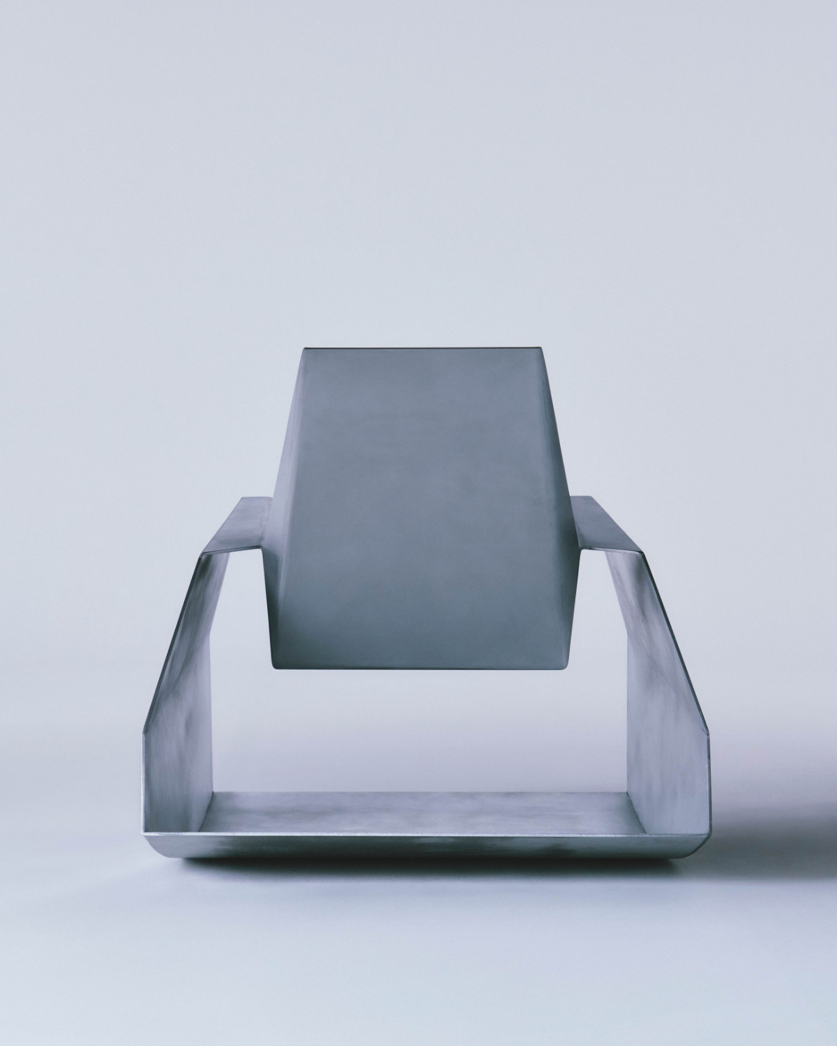 Godspeed by Waiting For Ideas — Godspeed chair photographed in frontal view against neutral ground, isolating the form against a pale backdrop.
