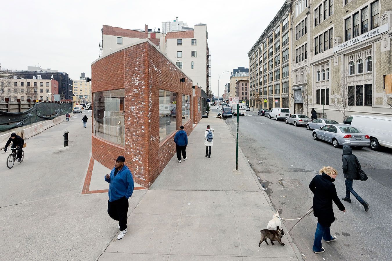 Yohji Yamamoto NYC Store by Junya Ishigami — Street-level photograph capturing the Yohji Yamamoto NYC Store's public pedestrian passage in active use.