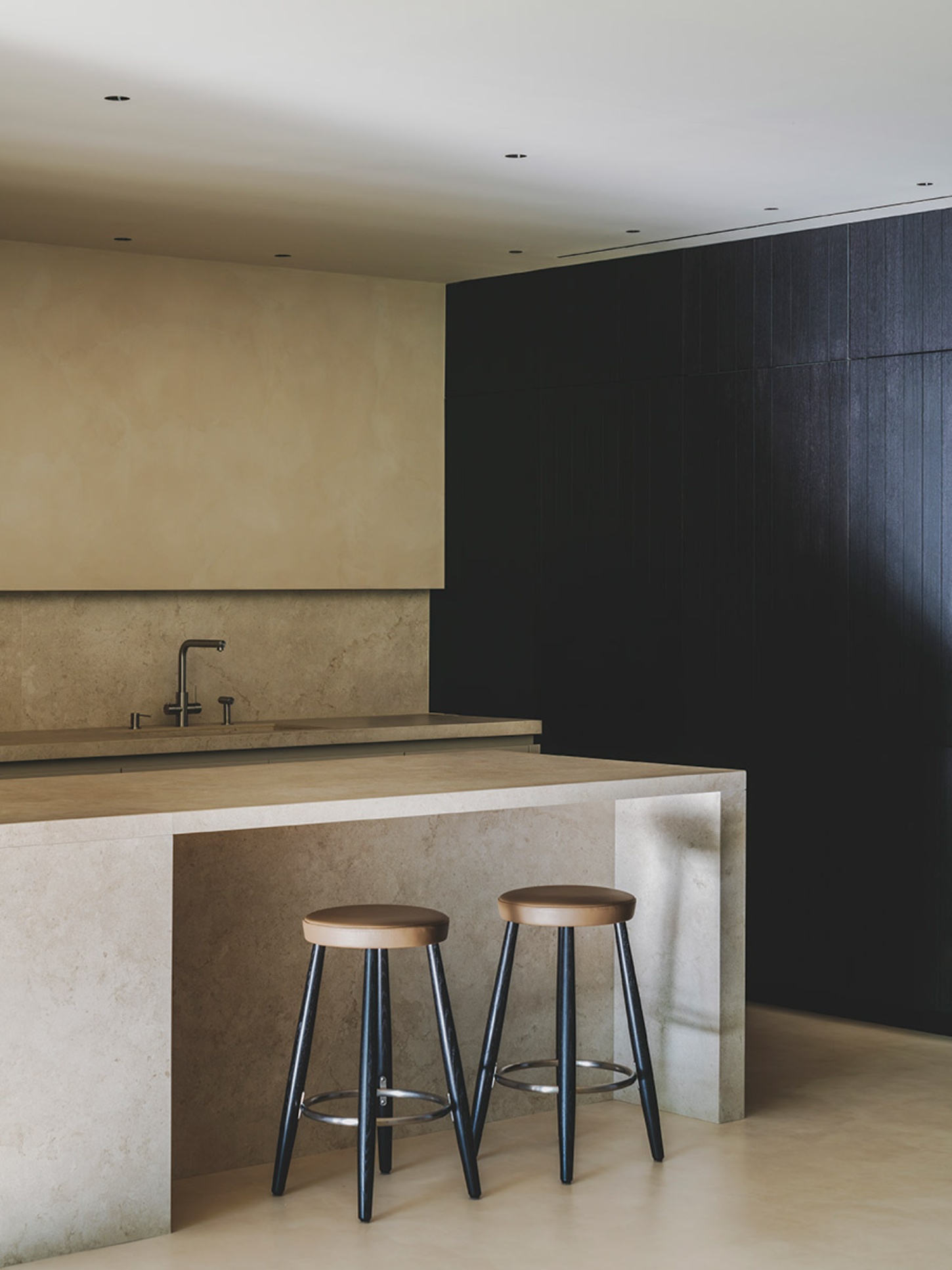 S29 House by Francesc Rifé Studio + Exit Projectes — The kitchen island anchors this minimalist interior through material contrast and spatial clarity.