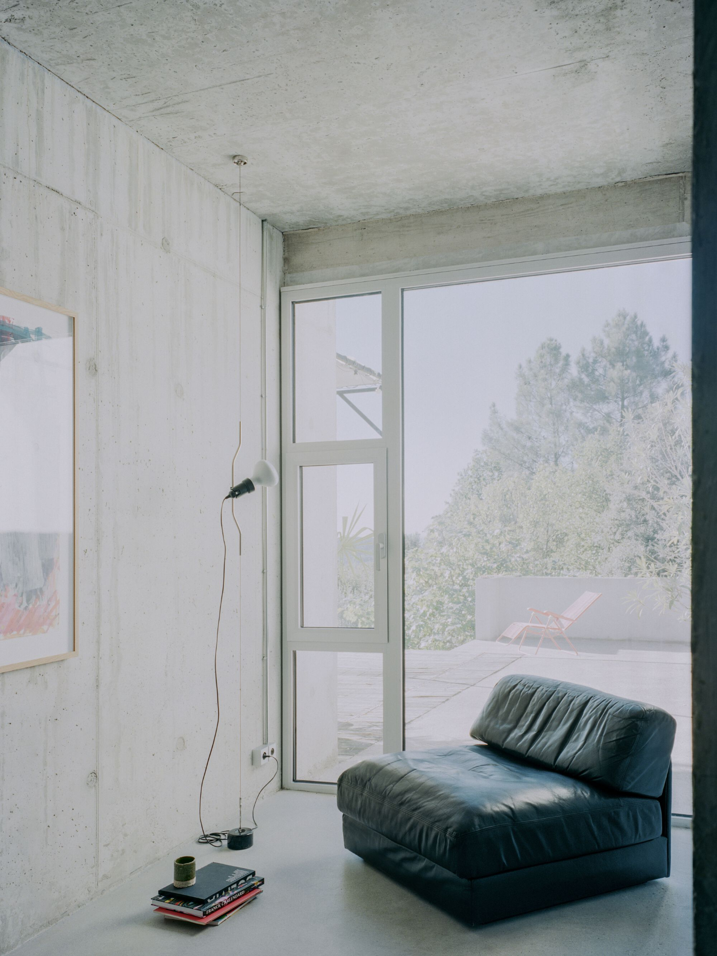 PAYZ House by Alors Studio — A bedroom interior punctuated by minimalist furnishing and direct landscape framing.