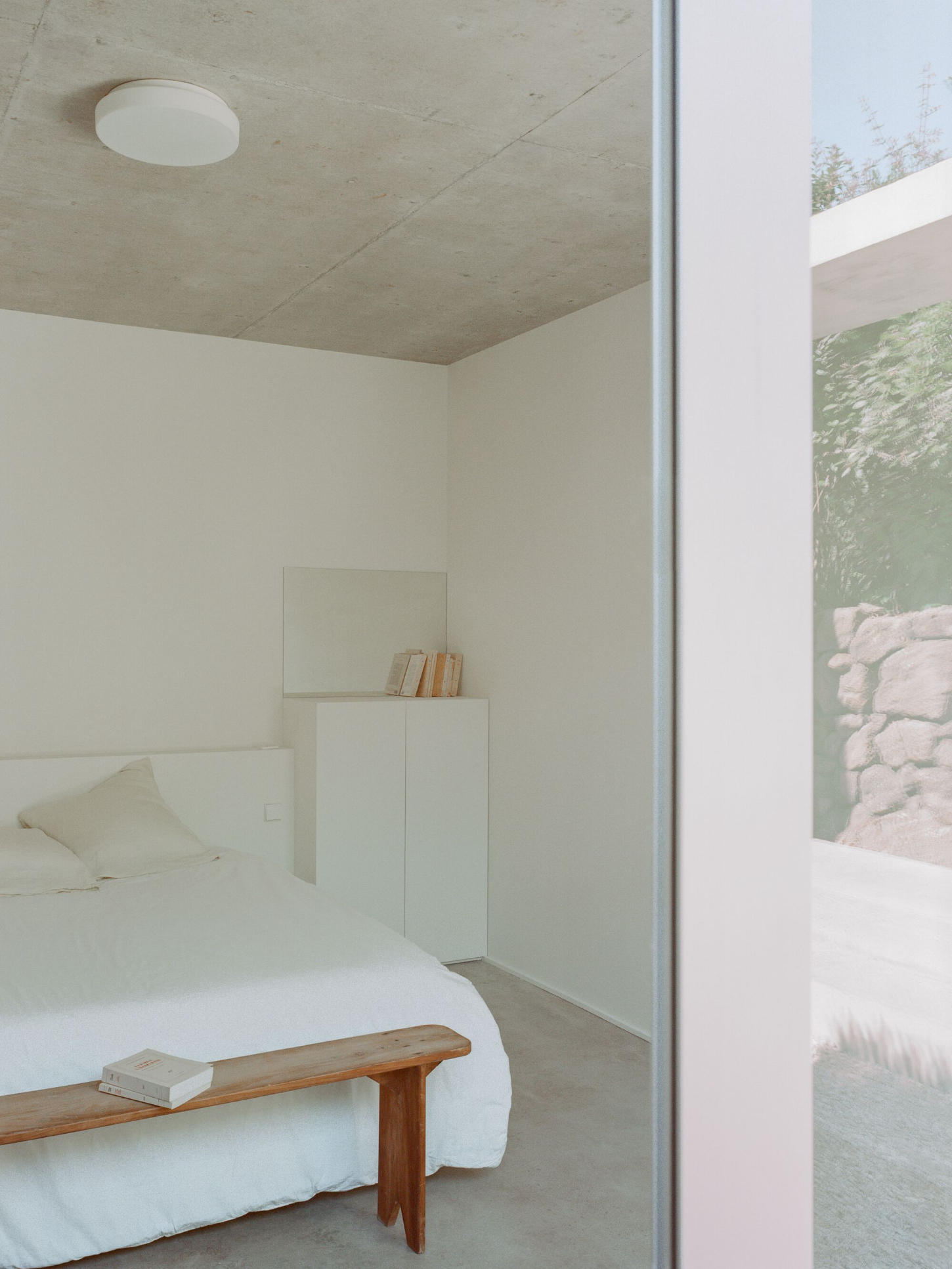 PAYZ House by Alors Studio — A bedroom alcove framed by a white-rendered threshold, displaying the minimalist spatial strategy of PAYZ House.