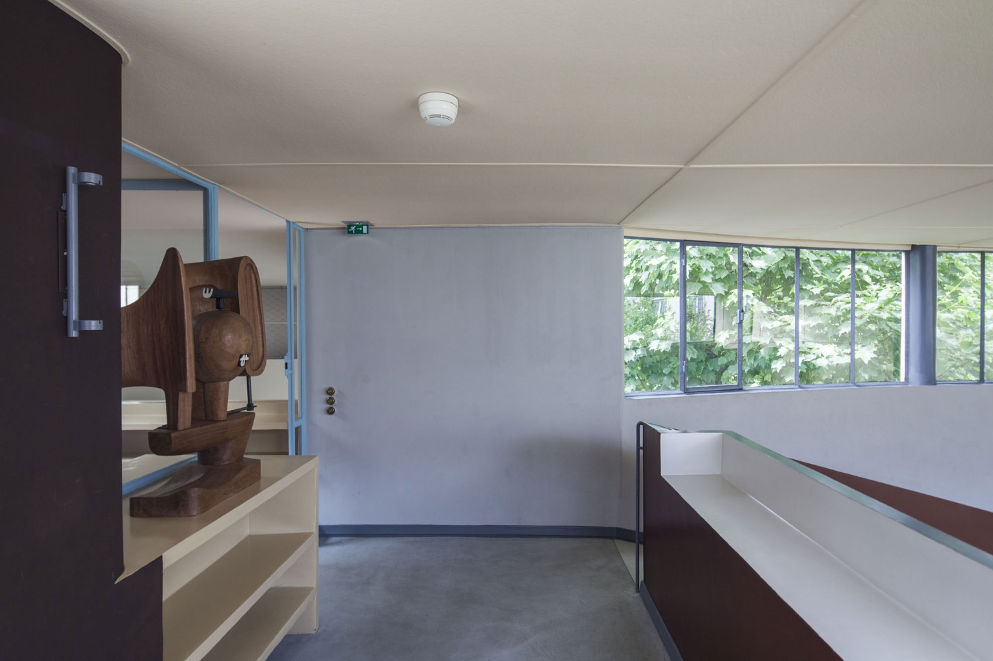 Maison La Roche-Jeanneret by Le Corbusier by Le Corbusier and Pierre Jeanneret — A gallery corridor within the Maison La Roche-Jeanneret showcases Le Corbusier's integration of art and architectural space.
