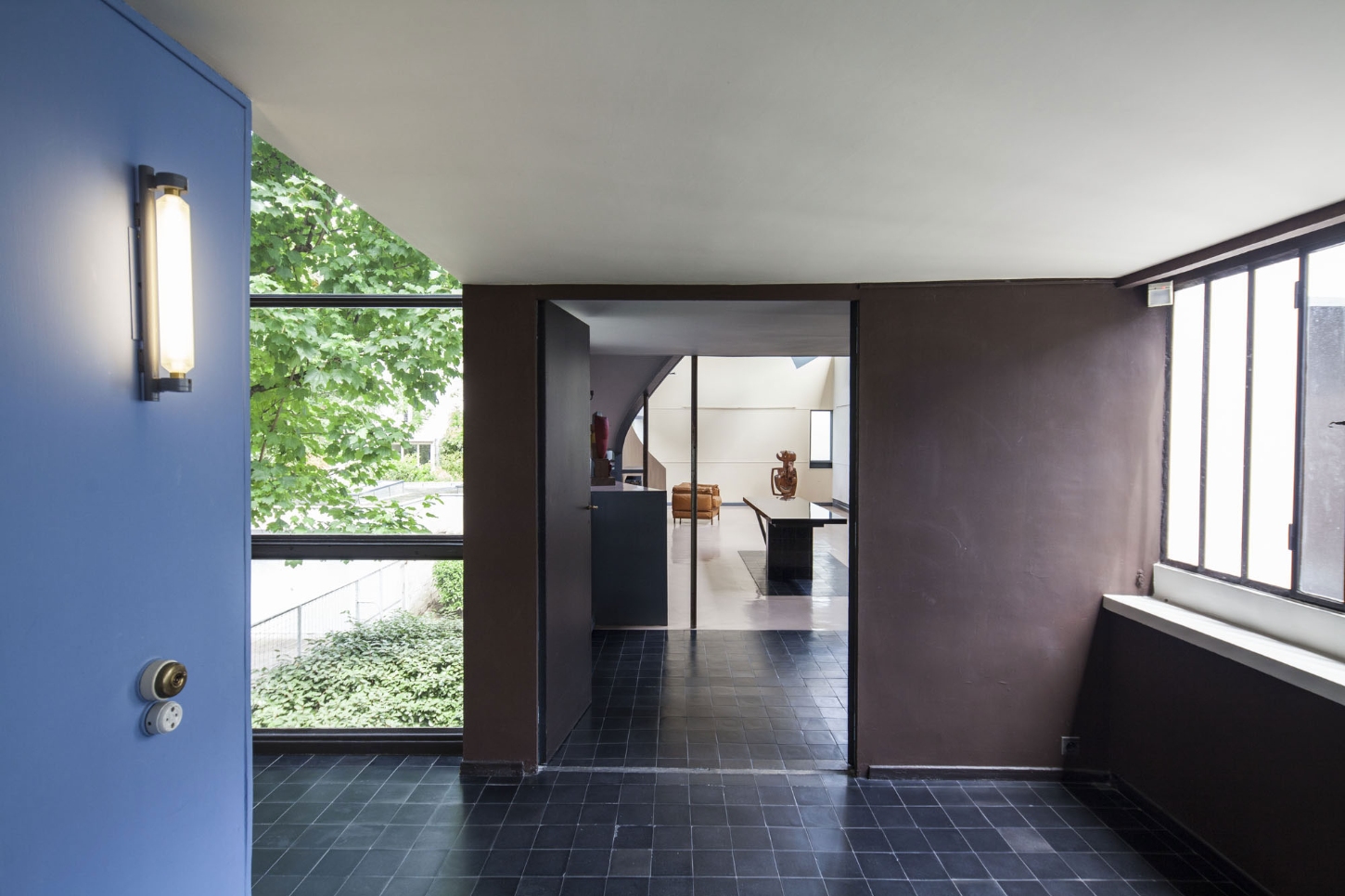 Maison La Roche-Jeanneret by Le Corbusier by Le Corbusier and Pierre Jeanneret — A threshold space at Maison La Roche-Jeanneret reveals Le Corbusier's spatial orchestration through material and light contrasts.
