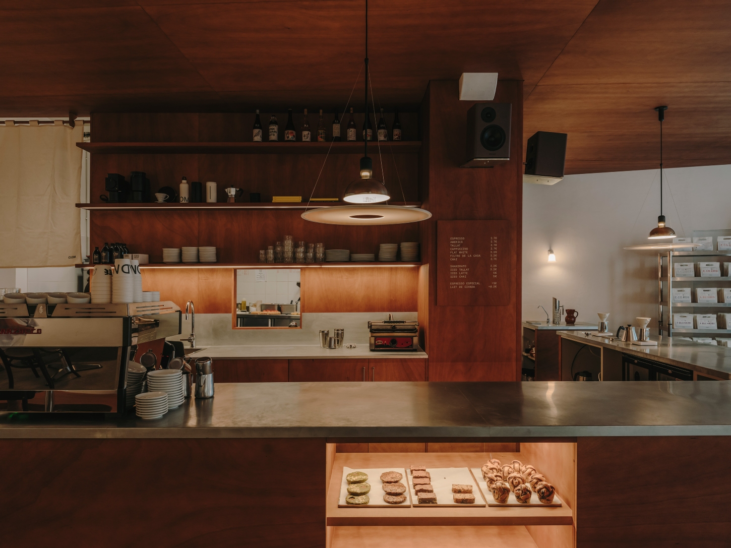 Nomad Coffee Frutas Selectas by Skye Maunsell and Jordi Veciana — A front-counter view of Nomad Coffee Frutas Selectas reveals the cafe's material hierarchy and operational logic.