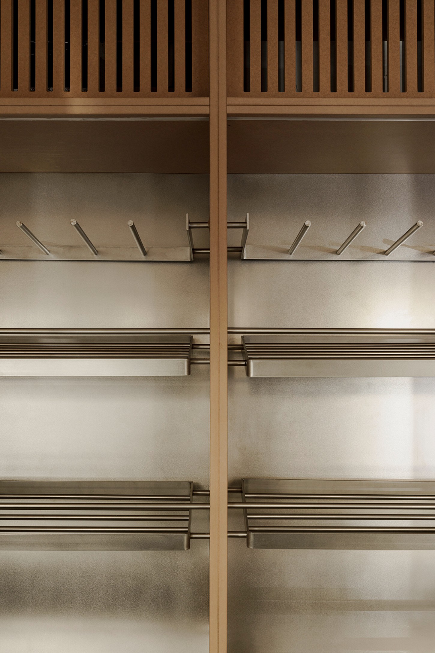 Madreamiga Madrid by estudio DIIR — Custom millwork display cabinetry for Madreamiga's bakery operations.