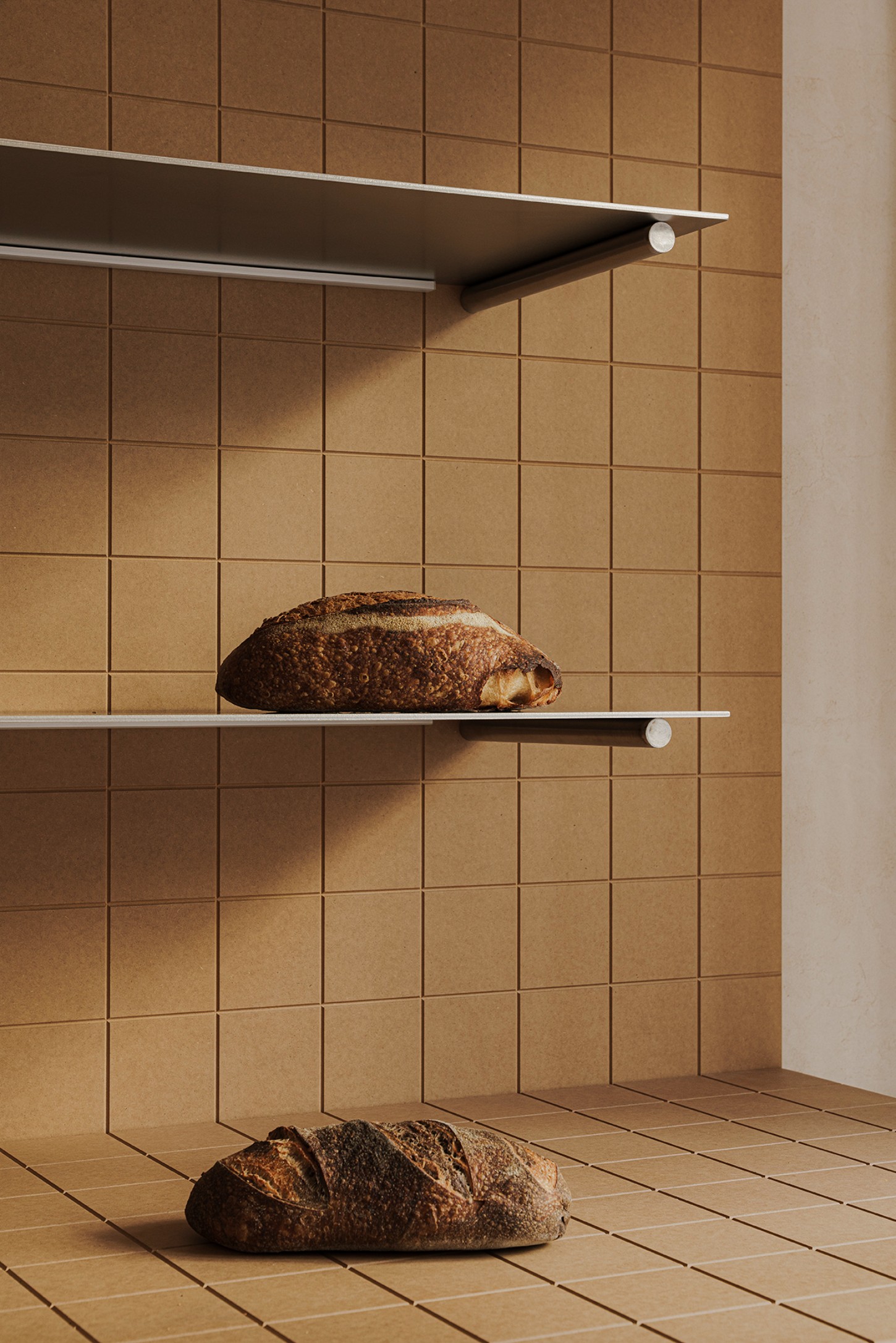 Madreamiga Madrid by estudio DIIR — A vertical display of artisan breads staged against a gridded terracotta tile wall.
