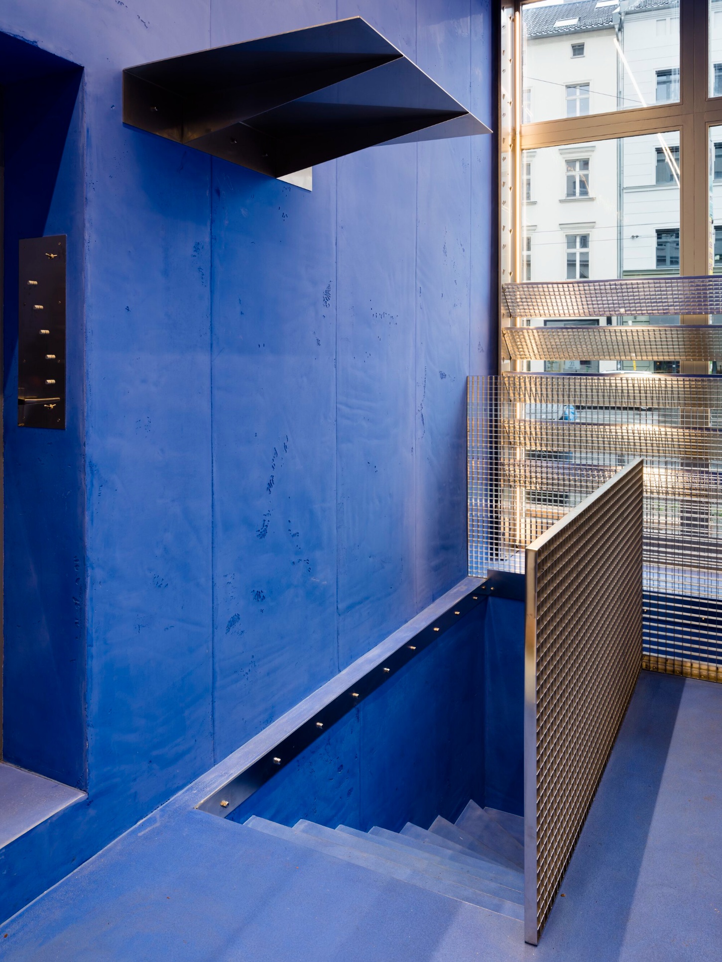 Aera Bakery by Gonzalez Haase AAS — A monochromatic interior defined by pervasive lapis lazuli blue applied uniformly across walls, floor, and ceiling.