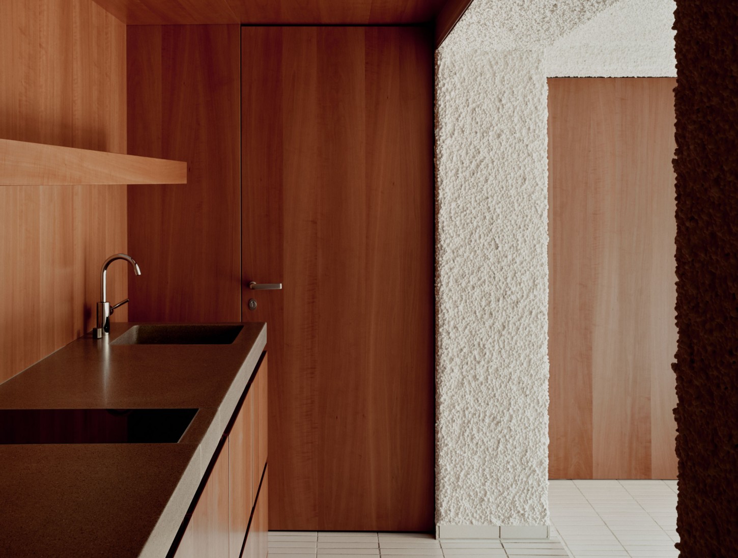 1930’s House Zurich by Ductus by Ductus St — A kitchen threshold negotiates between two material vocabularies.