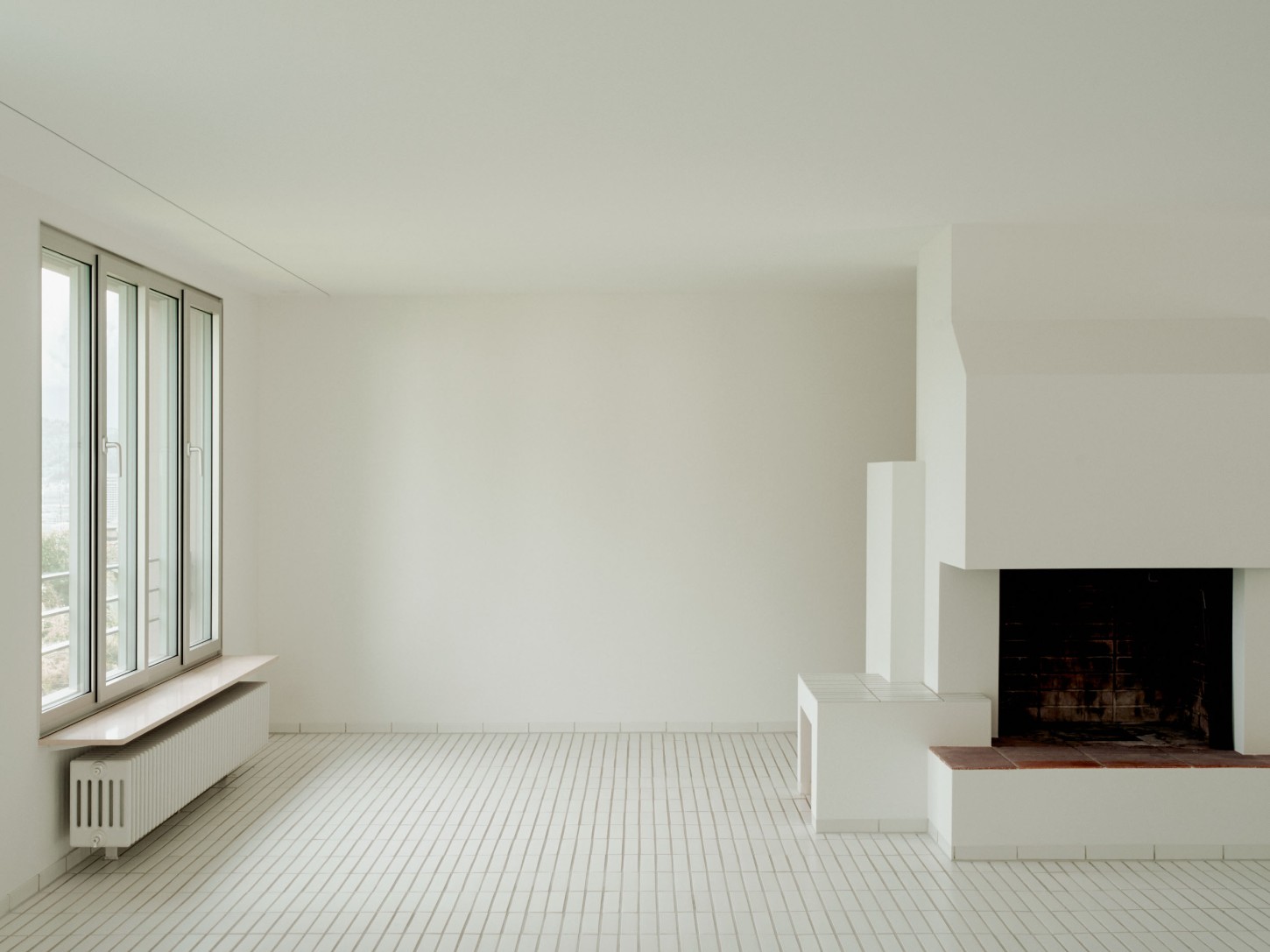1930’s House Zurich by Ductus by Ductus St — A renovated 1930s interior in Zurich demonstrates layered design history through material restraint.
