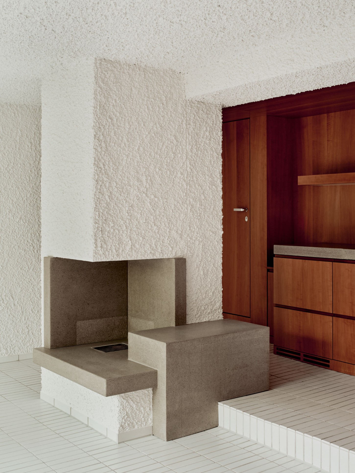 1930’s House Zurich by Ductus by Ductus St — A monolithic concrete bench and table form occupies the center of this 1930s Zurich interior, its sharp edges and clean planes establishing a sculptural...