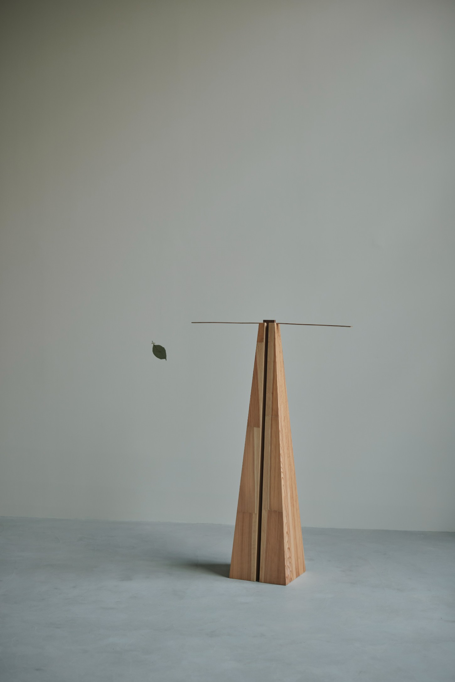'The Age of Wood' by CHRISTIAN + JADE in Karimoku Research — A conical timber structure with vertical slat construction serves as a sculptural object within the exhibition space.