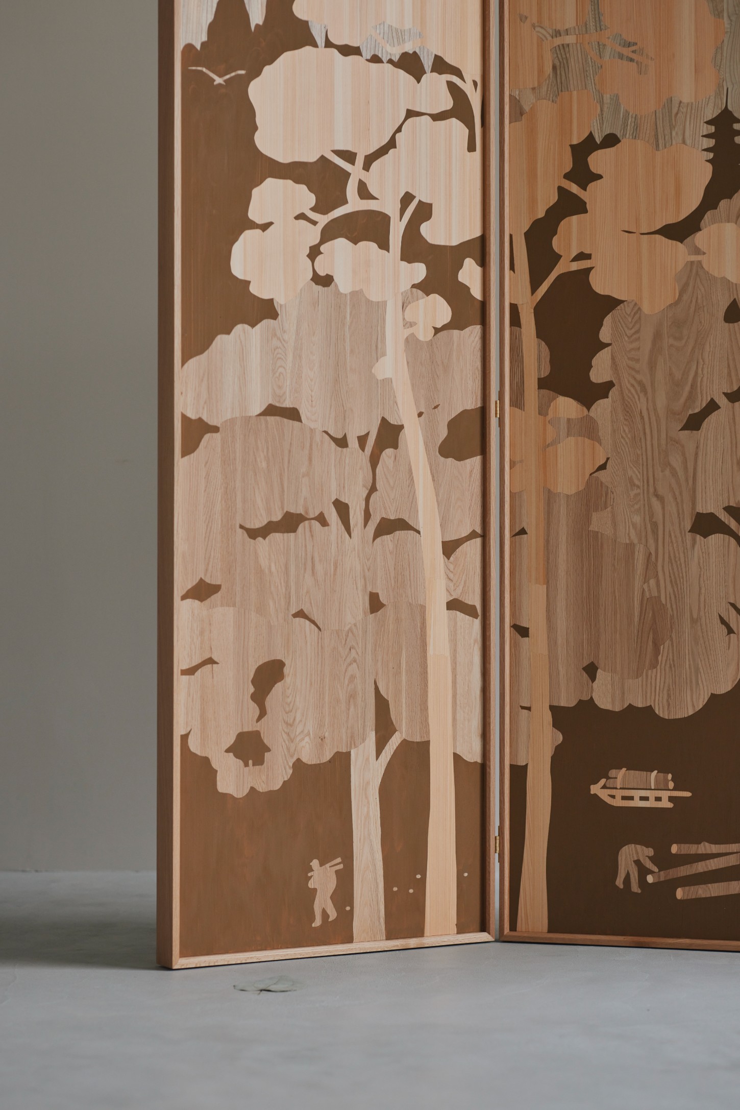 'The Age of Wood' by CHRISTIAN + JADE in Karimoku Research — A four-panel folding screen in contrasting wood tones demonstrates layered timber inlay work.