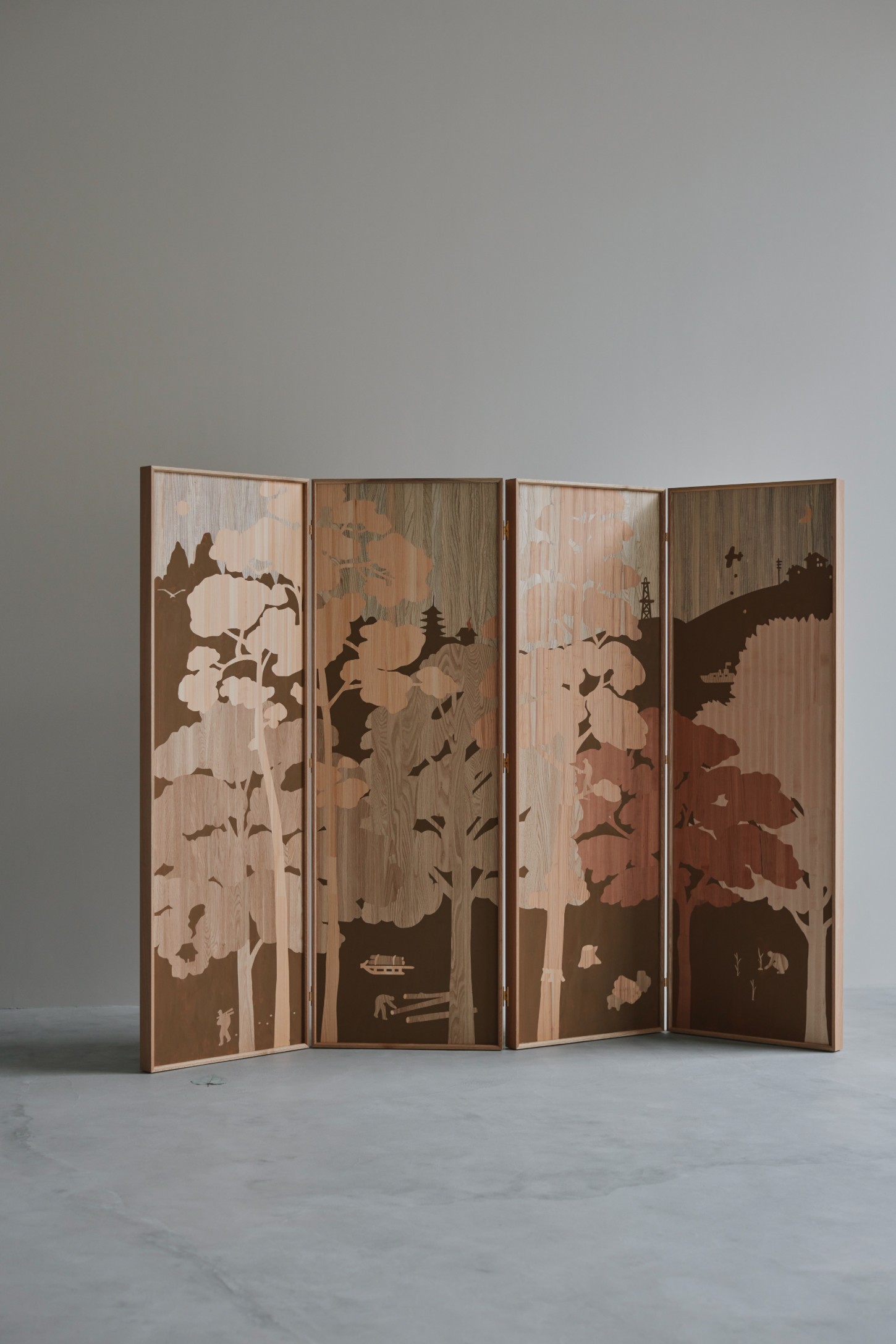 'The Age of Wood' by CHRISTIAN + JADE in Karimoku Research — A four-panel folding screen in contrasting wood tones showcases botanical silhouettes inlaid across its surface.