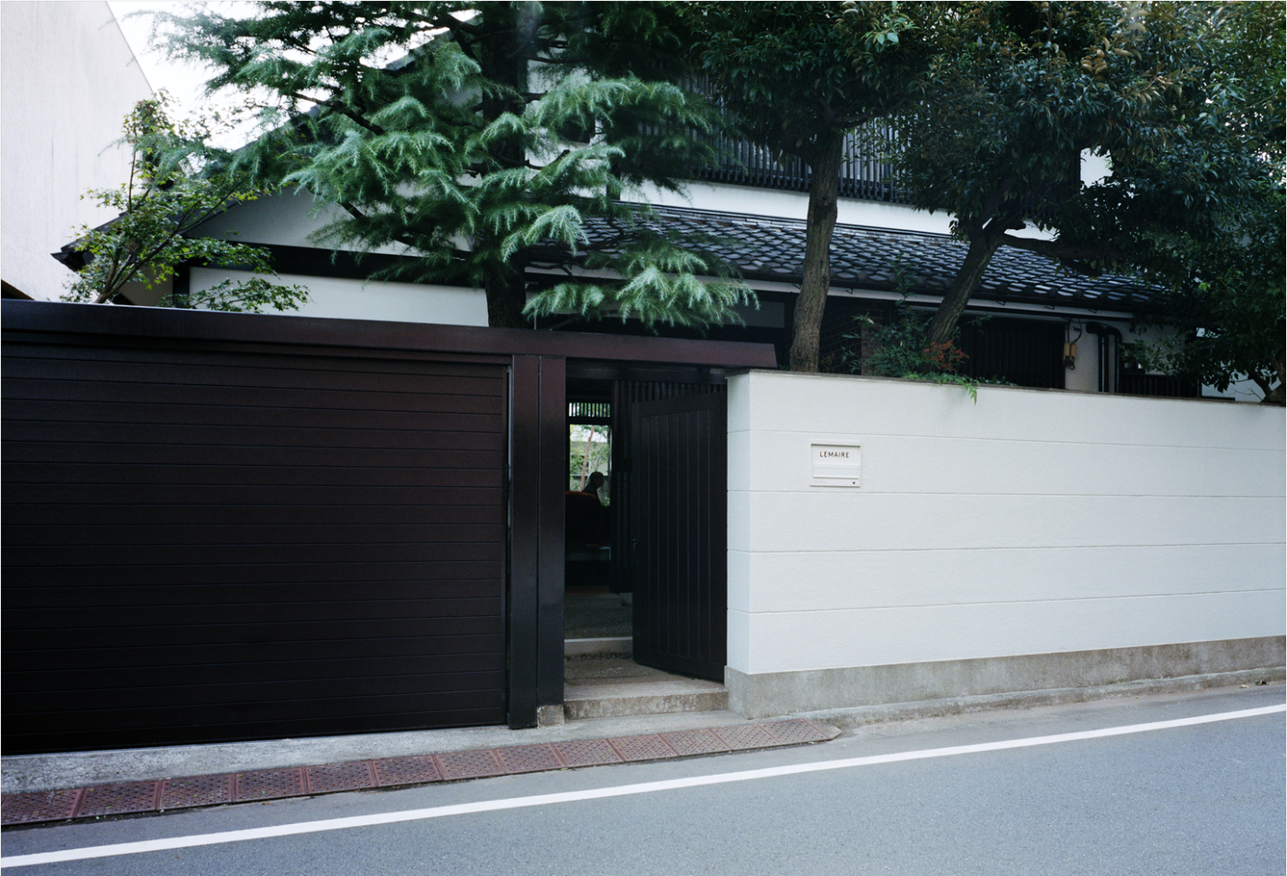 LEMAIRE Ebisu by Studio Hashimura by LEMAIRE by Studio Hashimura — The LEMAIRE Ebisu flagship entrance presents a studied exercise in material contrast and spatial compression.