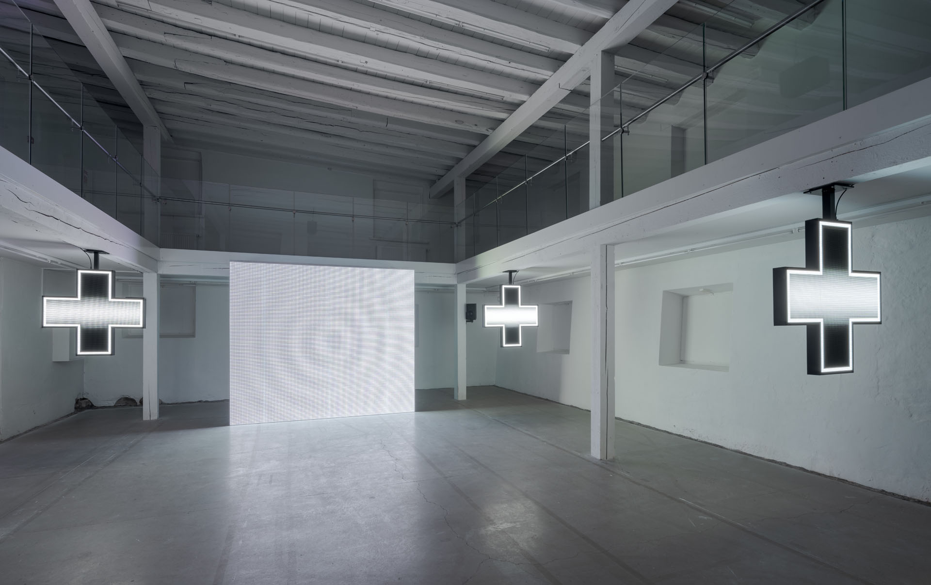 Milk Plus by Jens Settergren Viborg Kunsthal — A large-scale LED screen displays low-resolution pixel grid imagery in the center of an industrial gallery space.