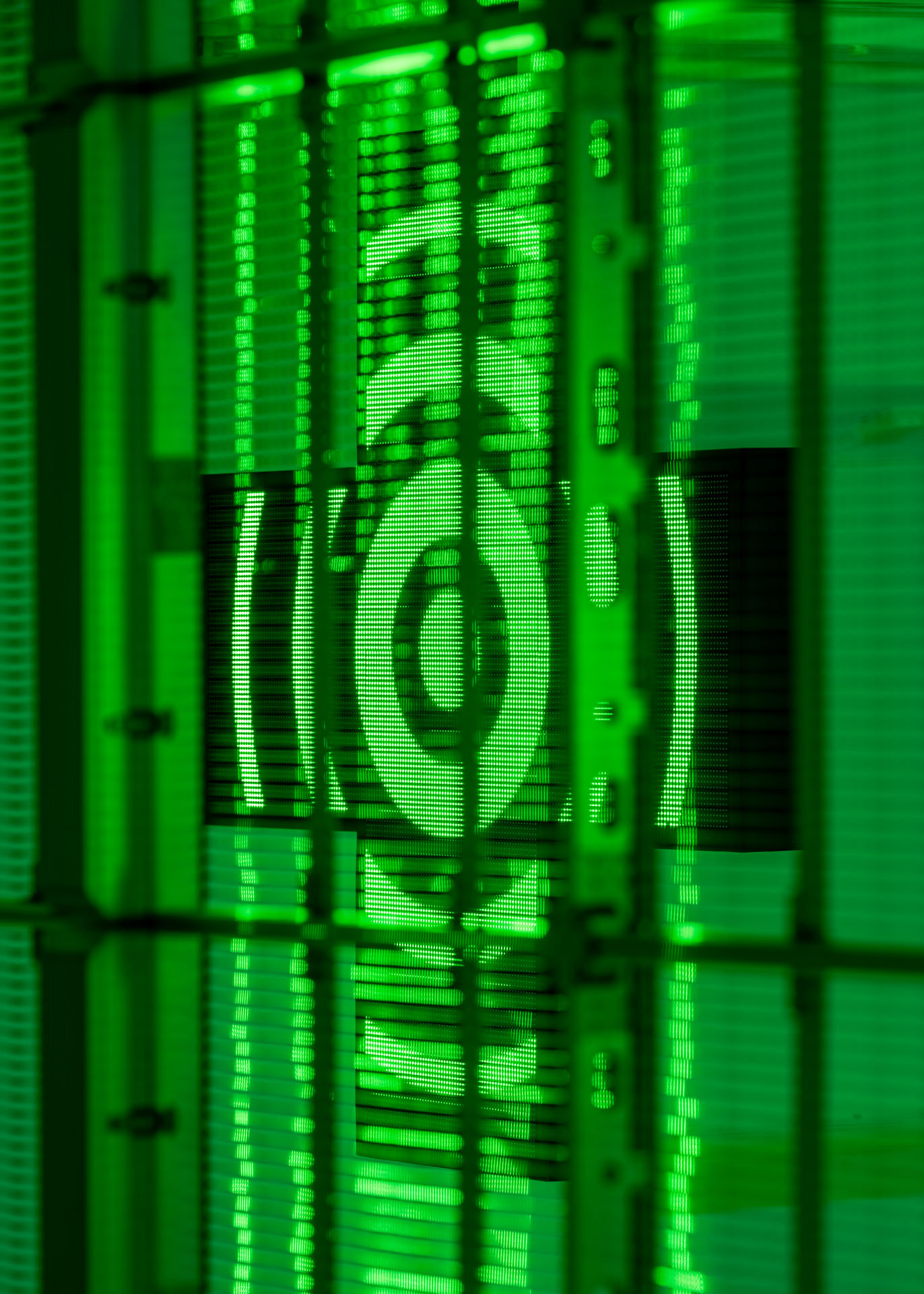 Milk Plus by Jens Settergren Viborg Kunsthal — A LED pixel grid screen dominates the composition, displaying a low-resolution portrait rendered in bright green monochromatic light.
