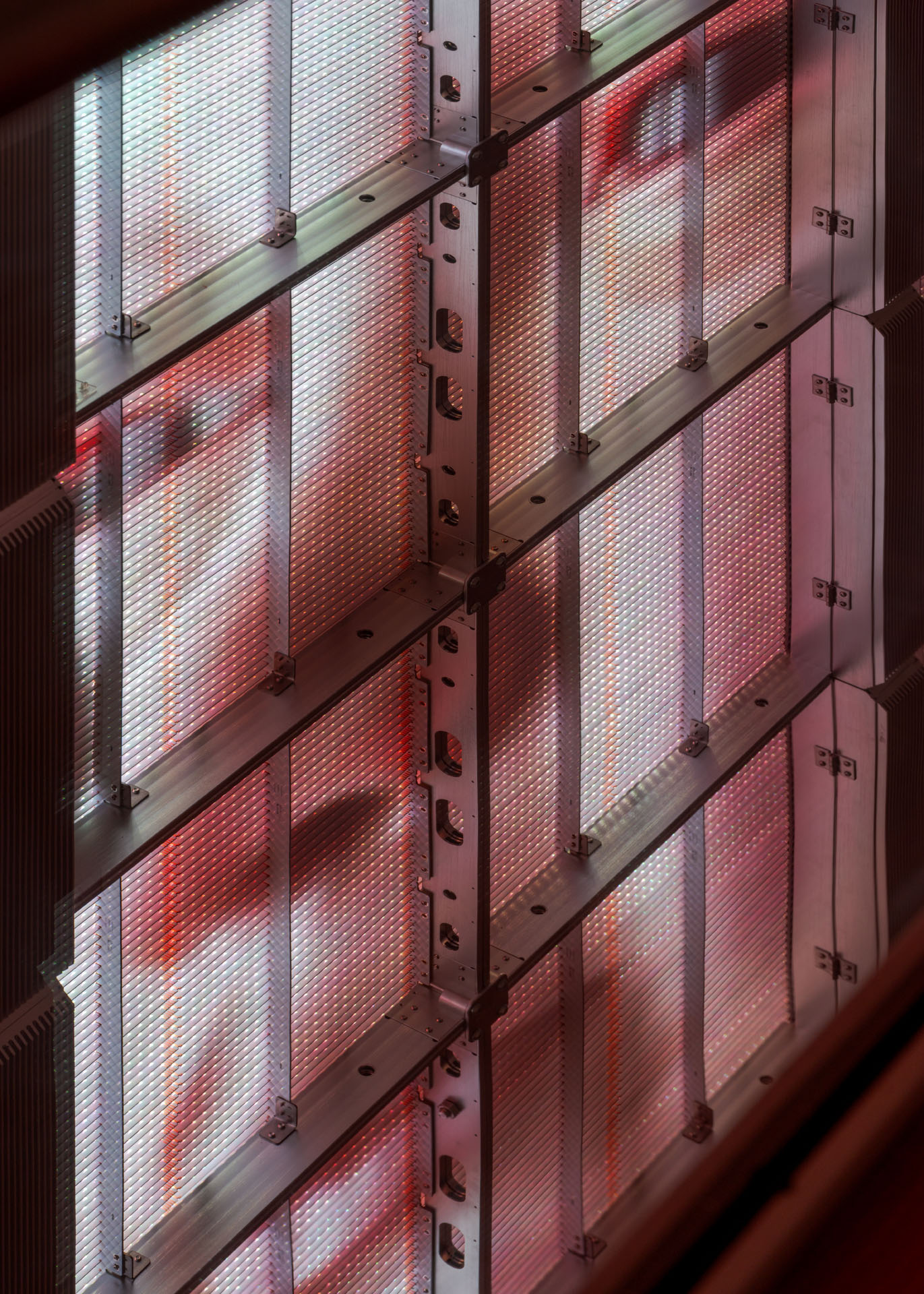 Milk Plus by Jens Settergren Viborg Kunsthal — A modular LED screen installation composed of stacked horizontal panels emitting red monochromatic light.