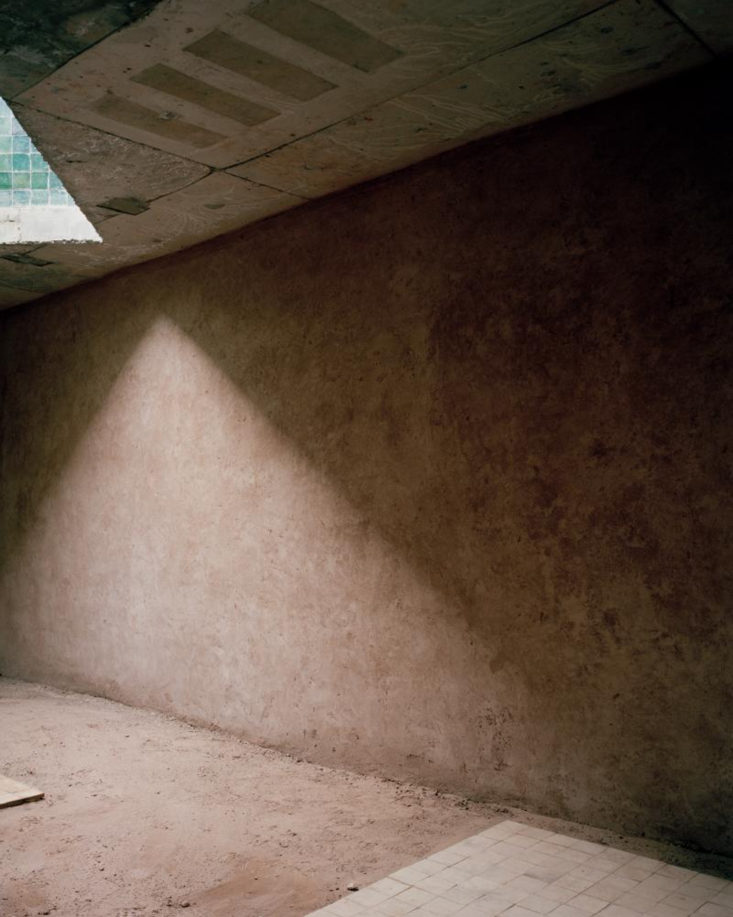 Dar El Farina by Leopold Banchini — A concrete corridor demonstrates the project's spatial strategy through a receding sequence of frameless thresholds.