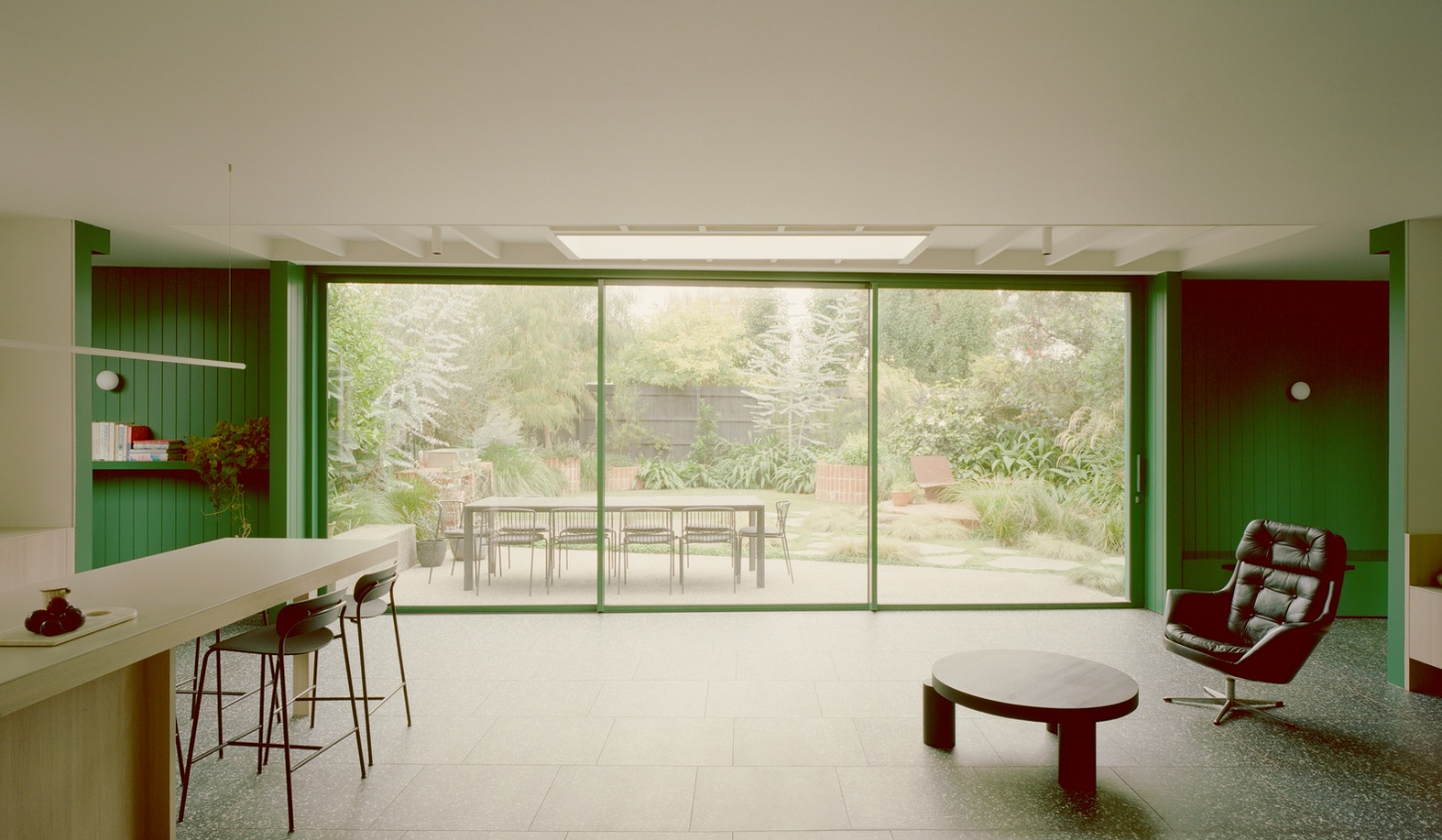 Garden Wall House by Sonelo Architects — The south-facing living spaces have been reimagined through expansive glazing and strategic color blocking.