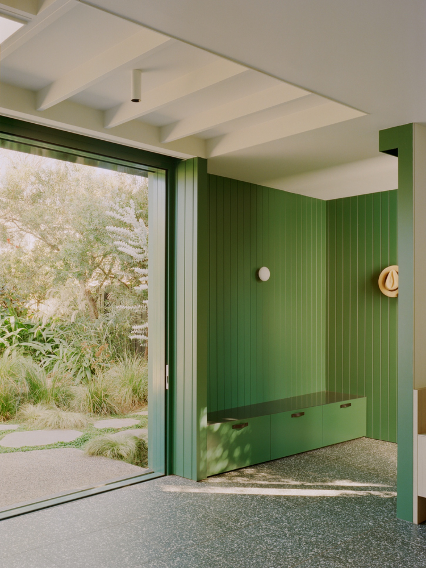 Garden Wall House by Sonelo Architects — A threshold space revealing the Garden Wall House's interior strategy.