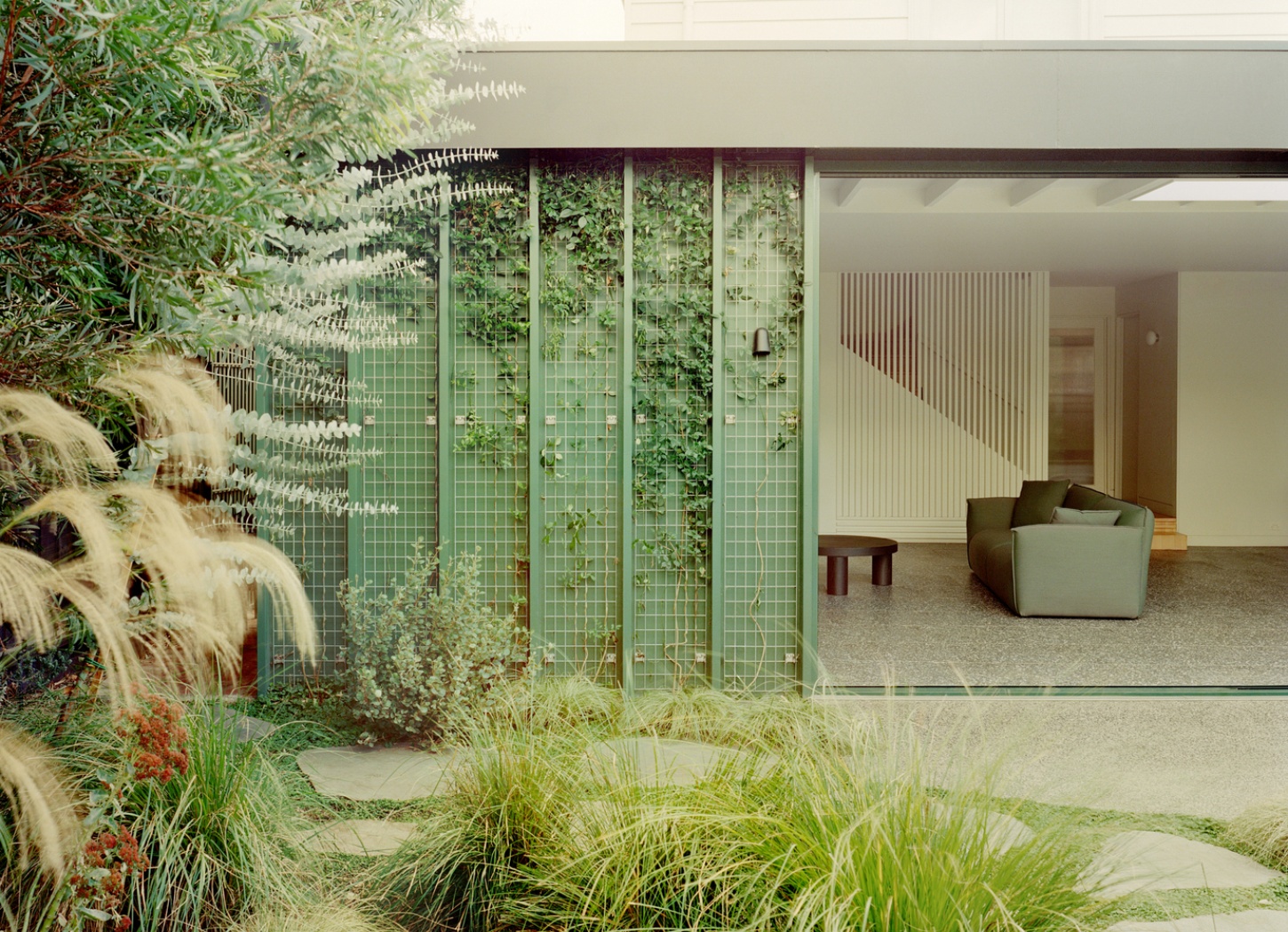 Garden Wall House by Sonelo Architects — A threshold view into the Garden Wall House reveals the deliberate integration of landscape and interior.