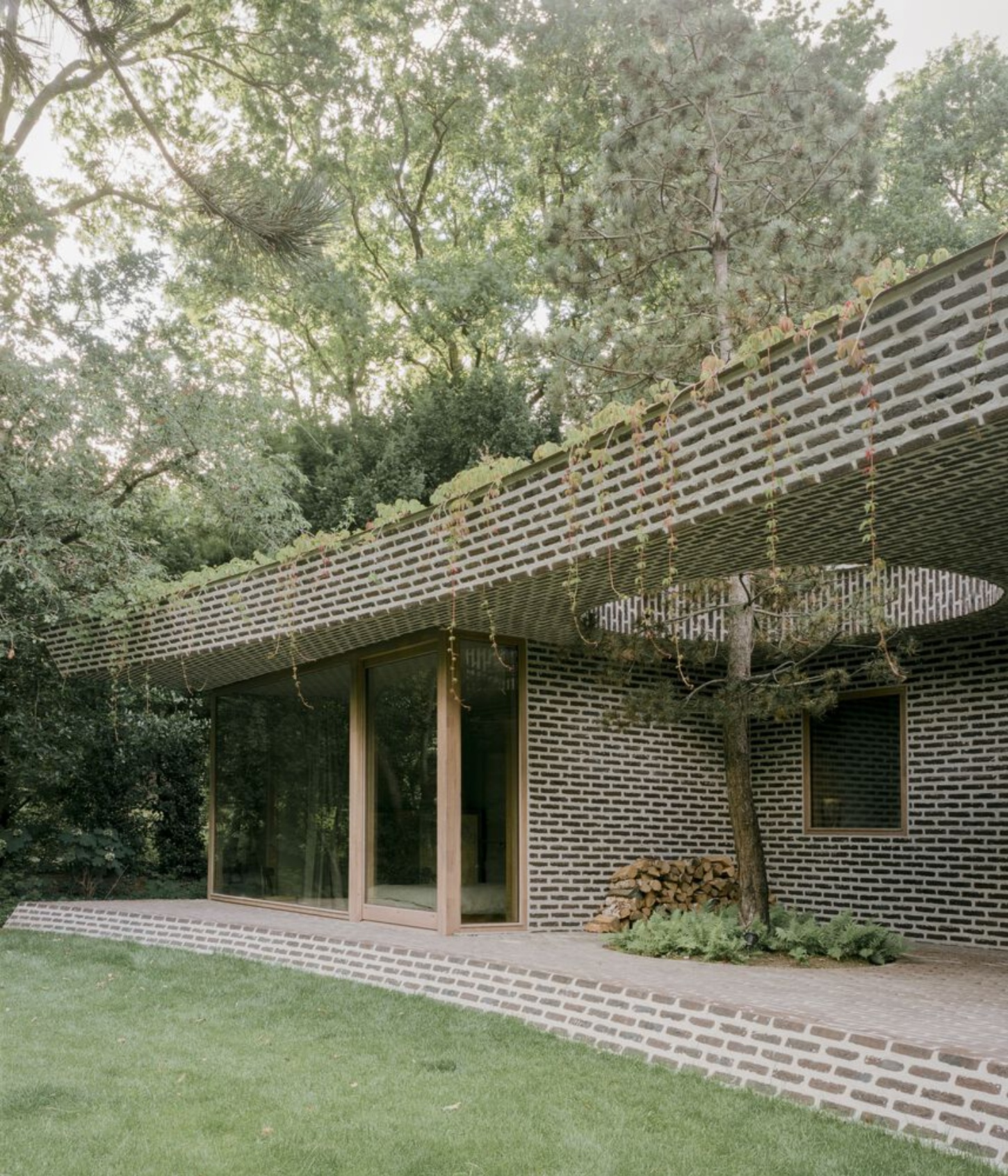 BD House by Space Encounters + Studio Vincent Architecture — The garden facade of BD House presents a study in horizontal rhythm and material continuity.
