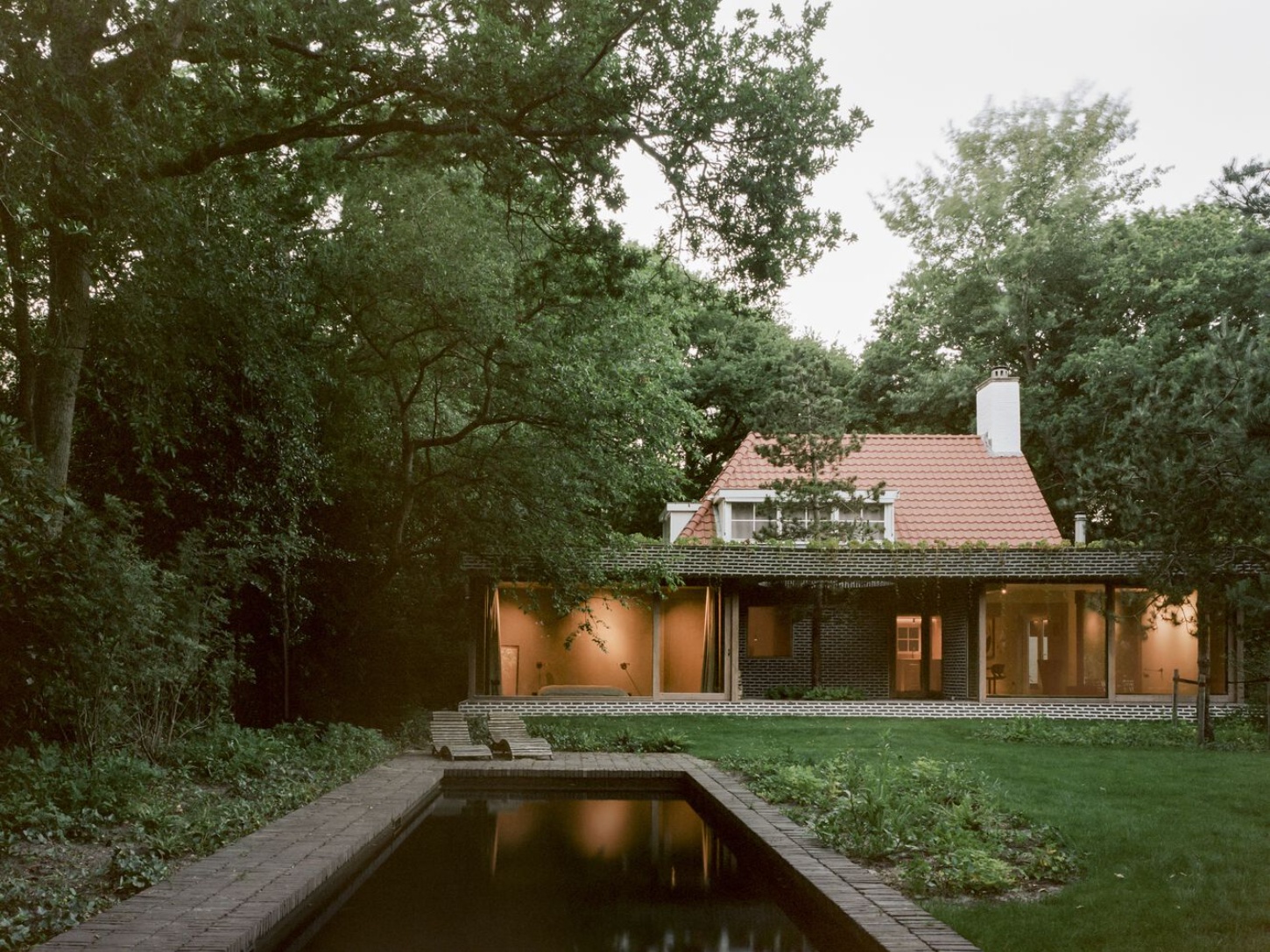 BD House by Space Encounters + Studio Vincent Architecture — The garden elevation reveals the renovation's reorientation toward landscape.
