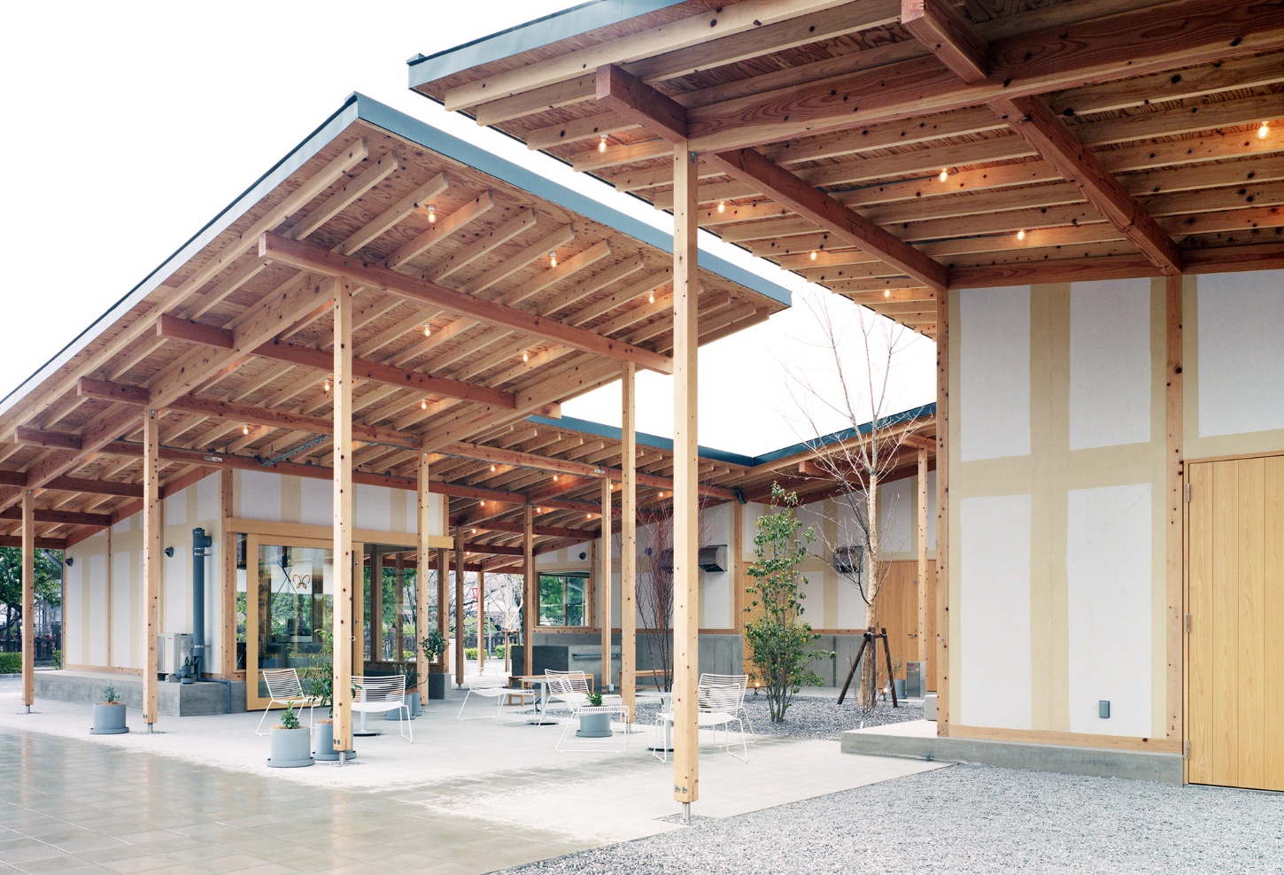 Funamachi Base Store by Jo Nagasaka + Schemata Architects — A timber-framed pavilion structure with exposed post-and-beam construction spanning the courtyard space.