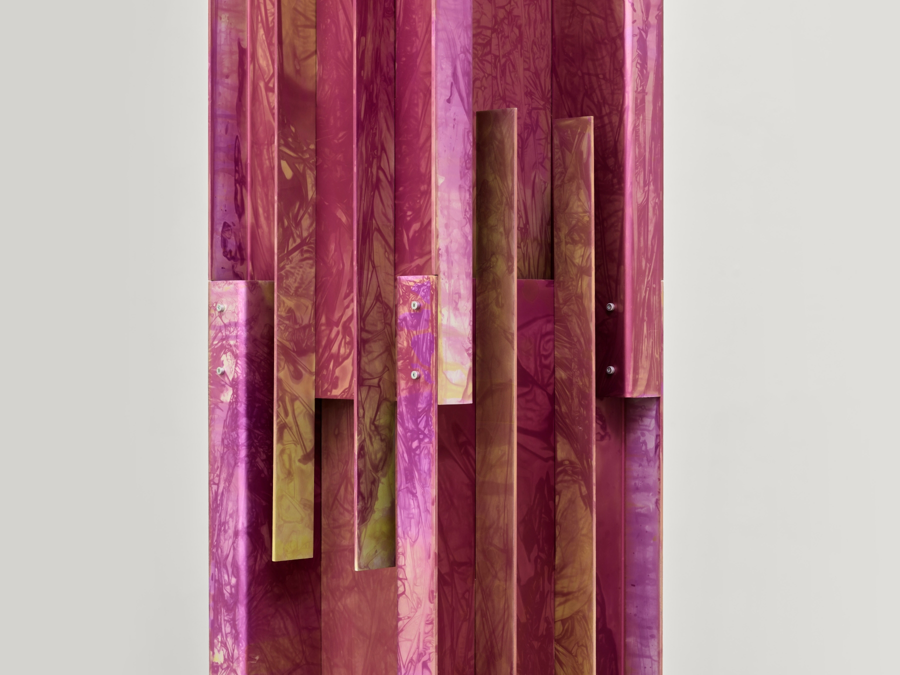 Anodized Collection by Paul Coenen — Hand-anodized aluminum panels arranged in a vertical composition, showcasing the Anodized Collection's signature rippling surface patterns.