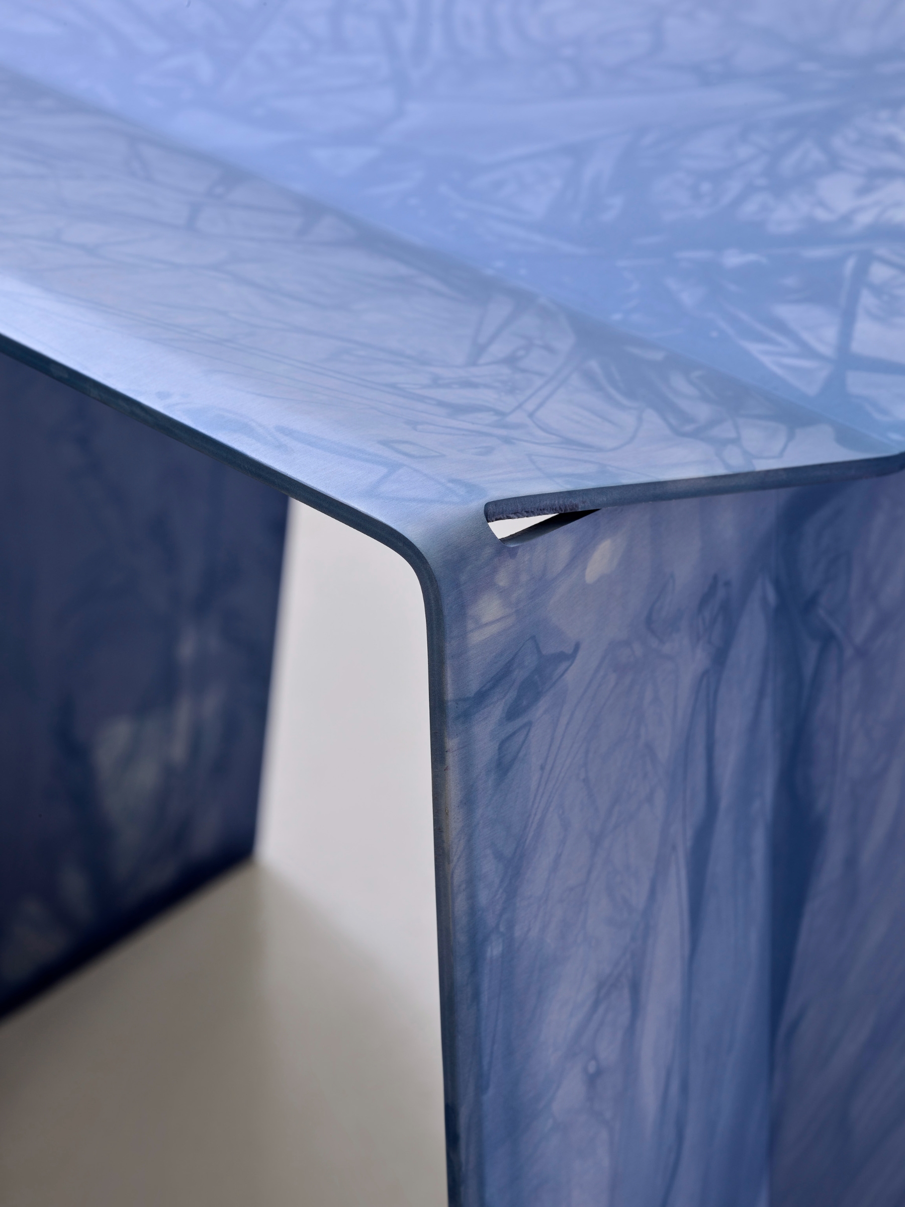 Anodized Collection by Paul Coenen — Close-up detail of a hand-anodized aluminum column from the Anodized Collection, capturing the distinctive rippling surface texture created through Coenen's...
