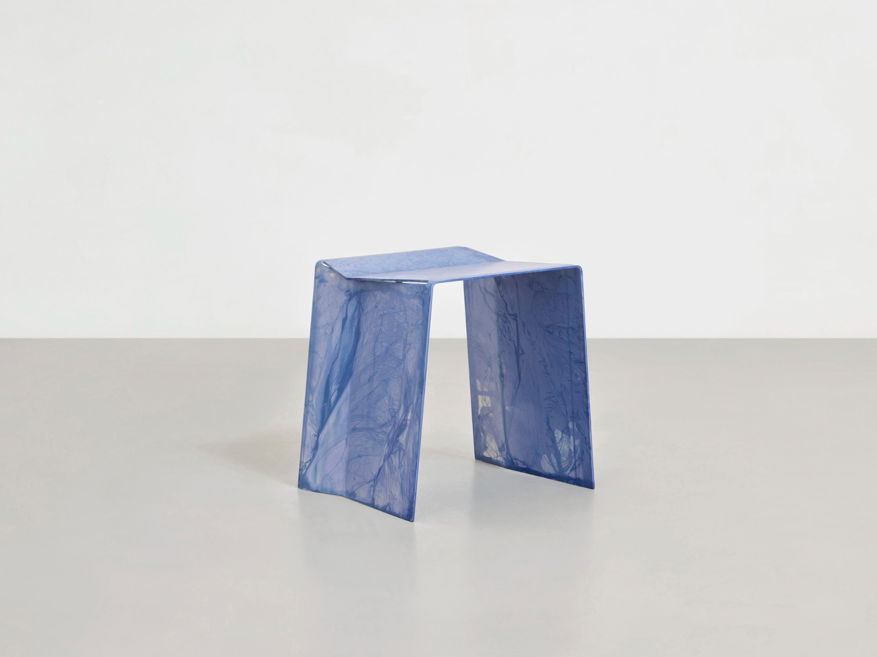 Anodized Collection by Paul Coenen — A compact stool from the Anodized Collection, rendered in hand-anodized aluminum with a vivid violet surface.